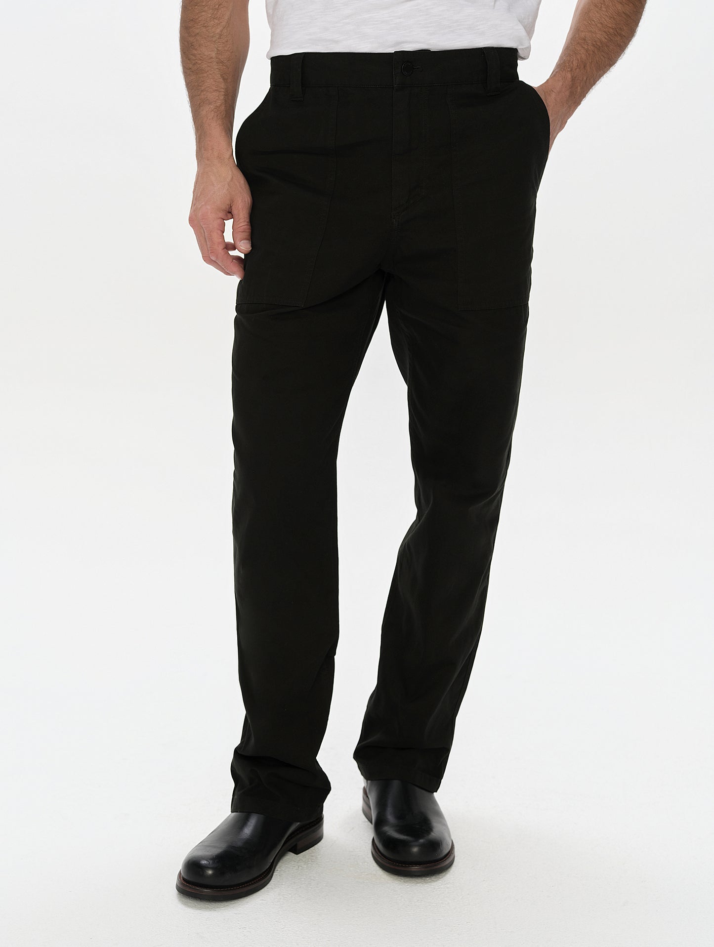 Front, lower-body view of man wearing the Gage Cotton Pant in Onyx Black from AETHER Apparel.
