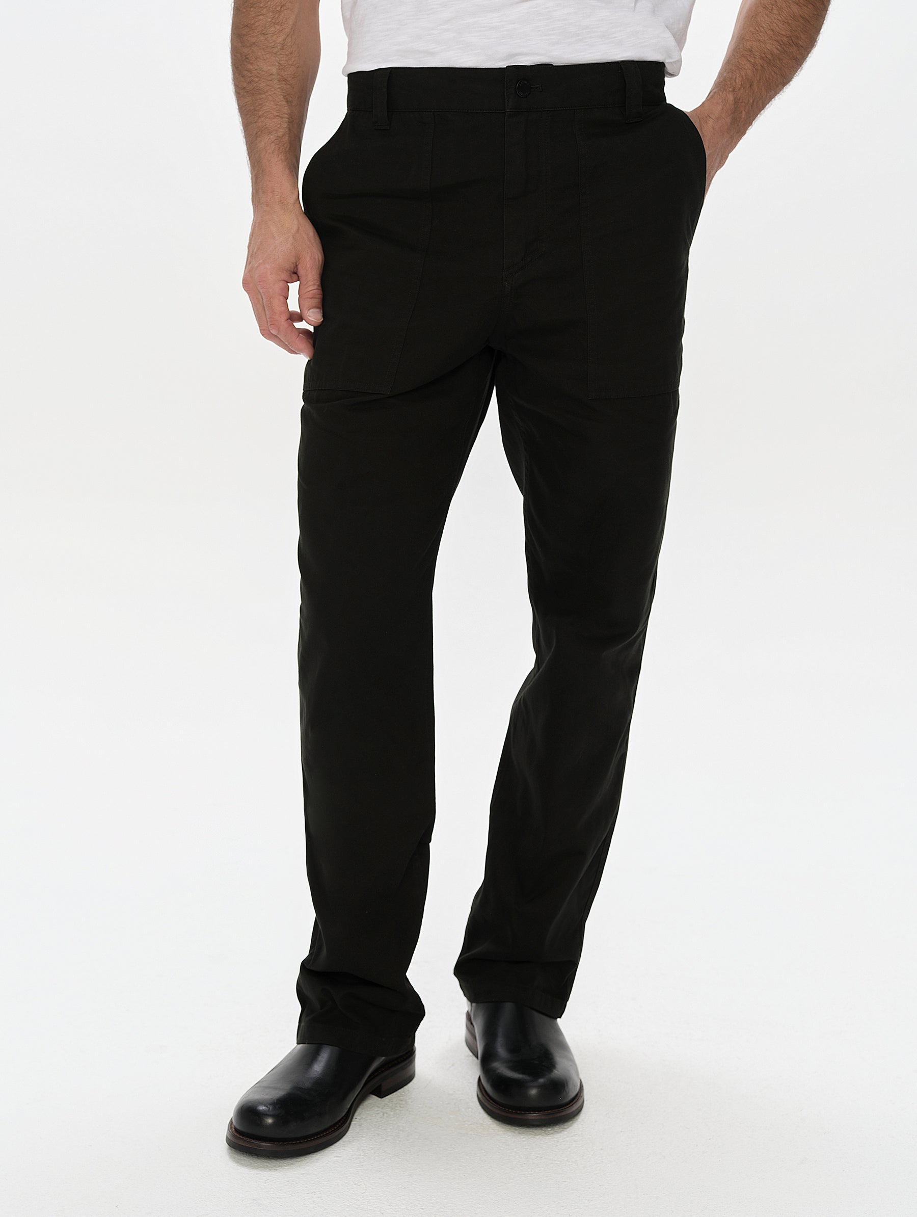 Front, lower-body view of man wearing the Gage Cotton Pant in Onyx Black from AETHER Apparel.