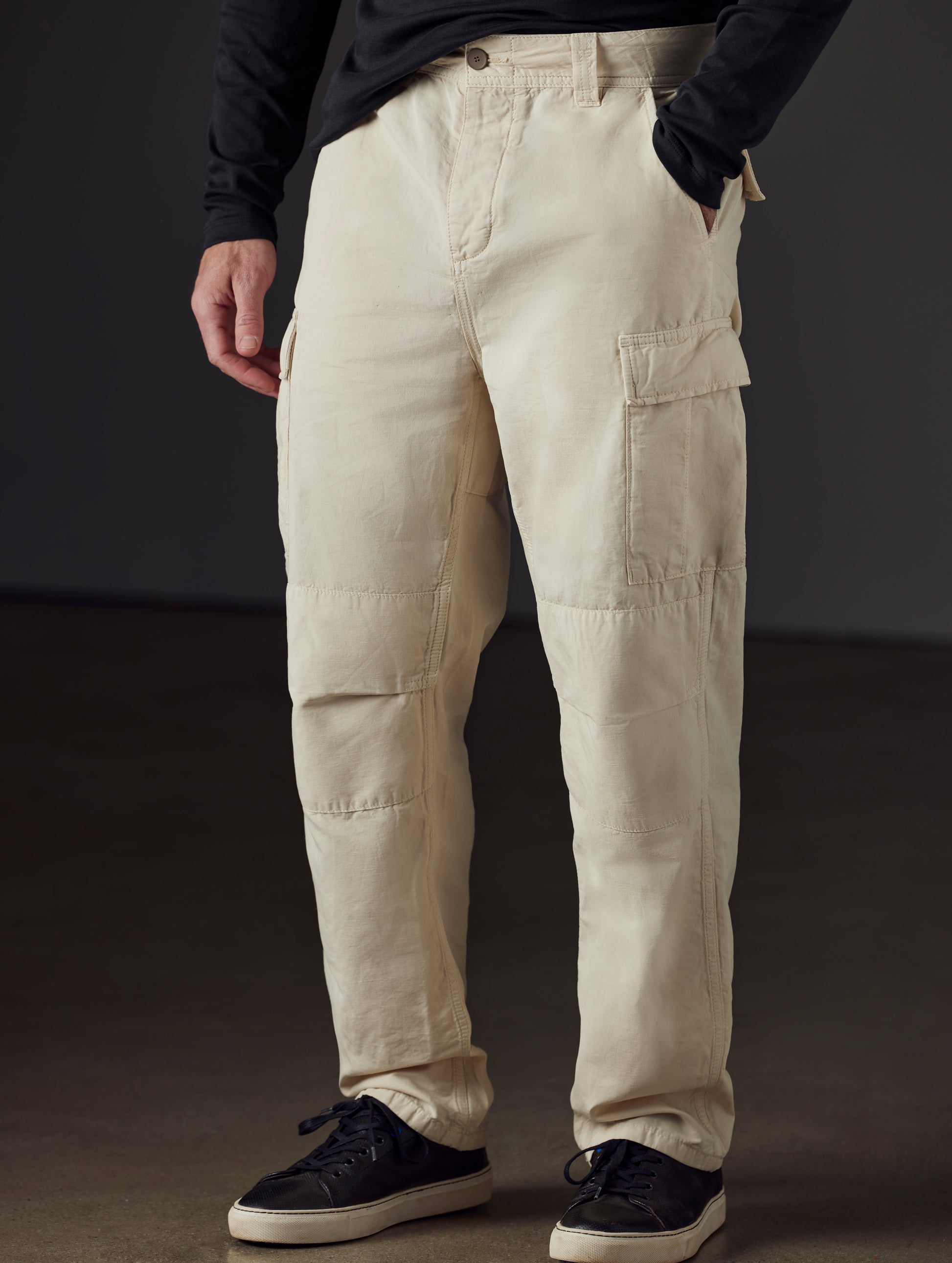 Front 3/4 lower body view of man wearing Glade Fatigue Pant in Bone white from AETHER Apparel.