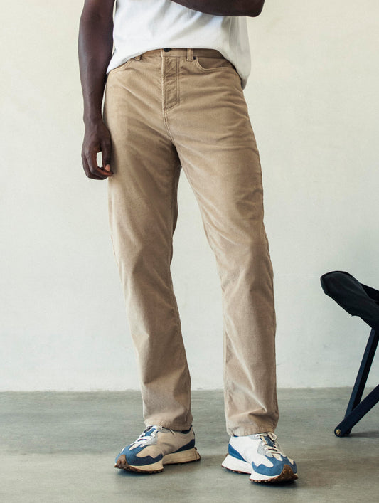 Front lower body view of man wearing Hayden Corduroy Pant in Desert Tan from AETHER Apparel.