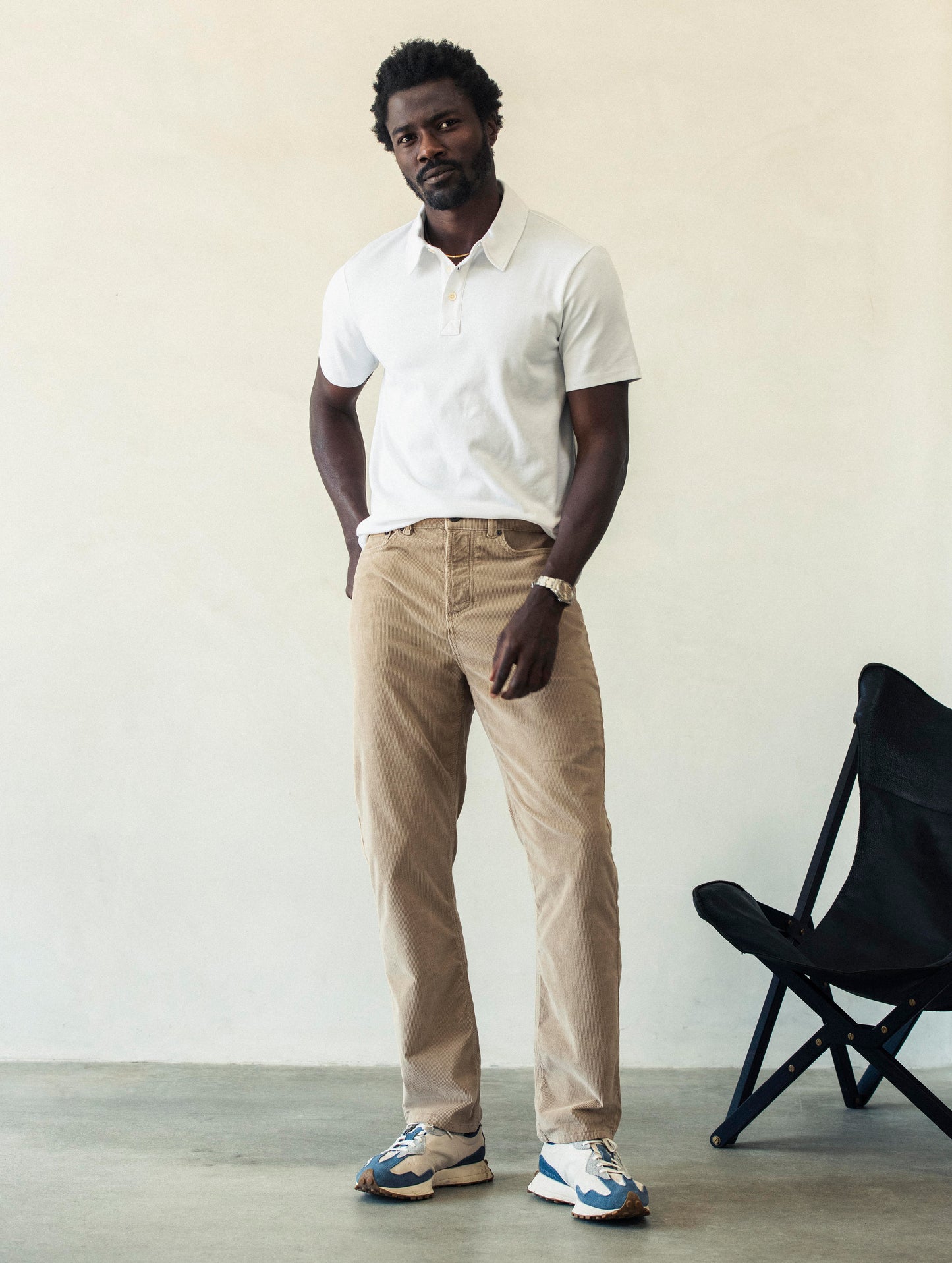 Front full-body view of man wearing Hayden Corduroy Pant in Desert Tan from AETHER Apparel.
