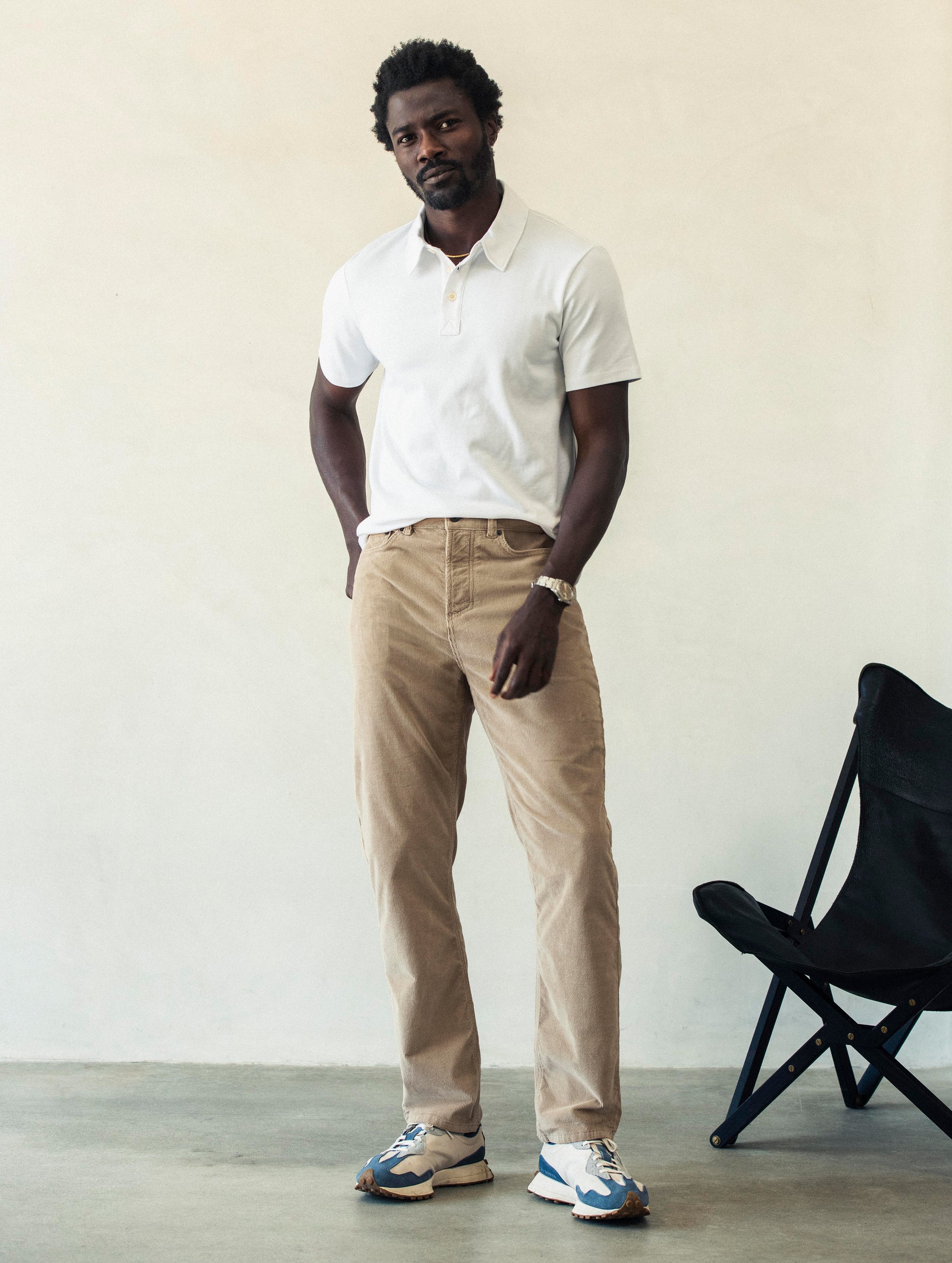 Front full-body view of man wearing Hayden Corduroy Pant in Desert Tan from AETHER Apparel.