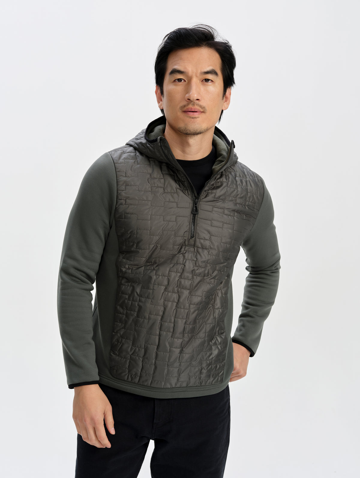 Front upper-body view of man wearing the Hybrid Tech Anorak in Saville Green from AETHER Apparel. 