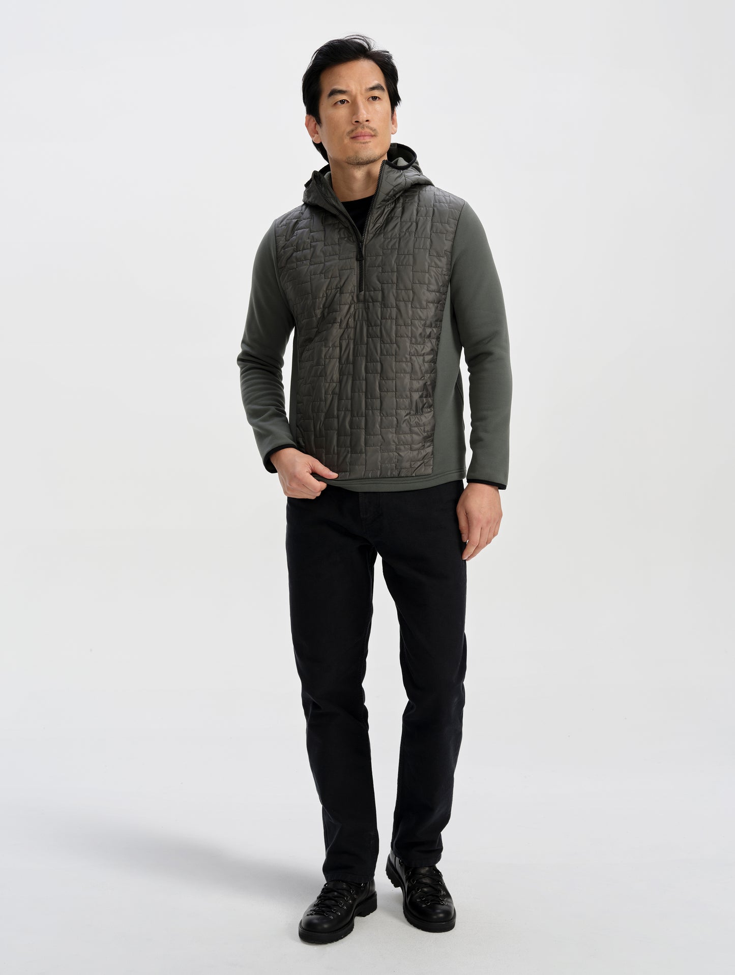 Front full-body view of man wearing the Hybrid Tech Anorak in Saville Green from AETHER Apparel. 