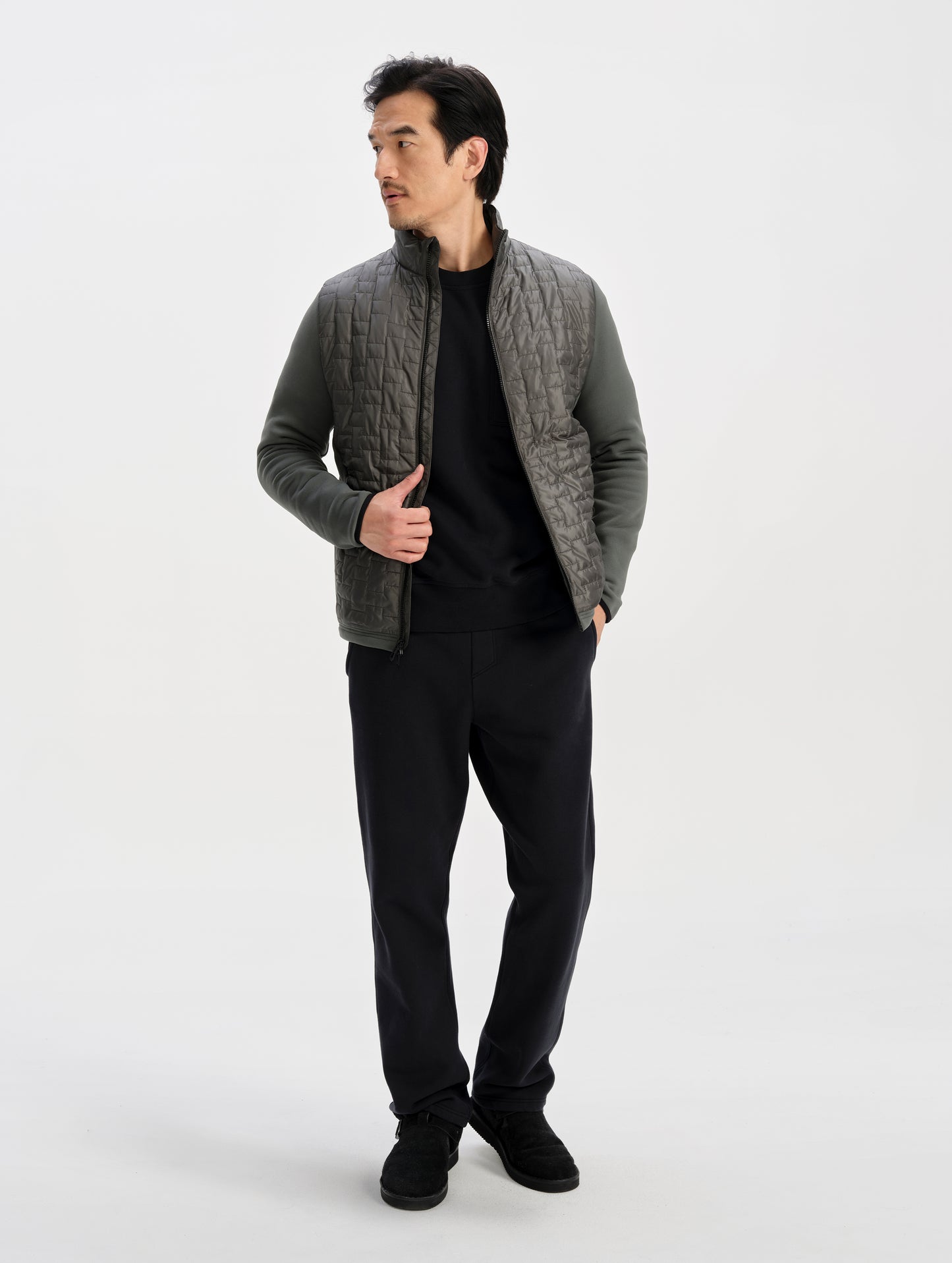 Front full-body view of man wearing the Hybrid Tech Full-Zip 2.0 in Saville Green from AETHER Apparel. 