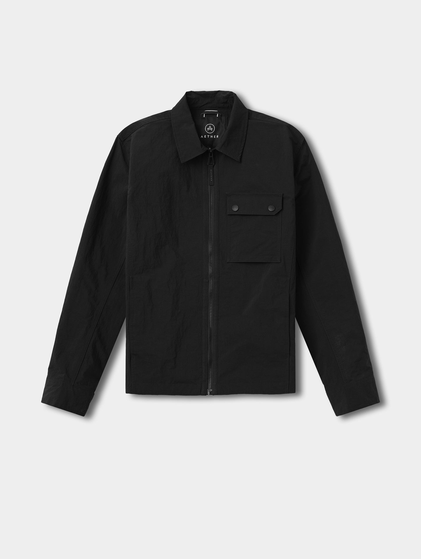 Flat lay view of the Landon Jacket in Onyx Black from AETHER Apparel.