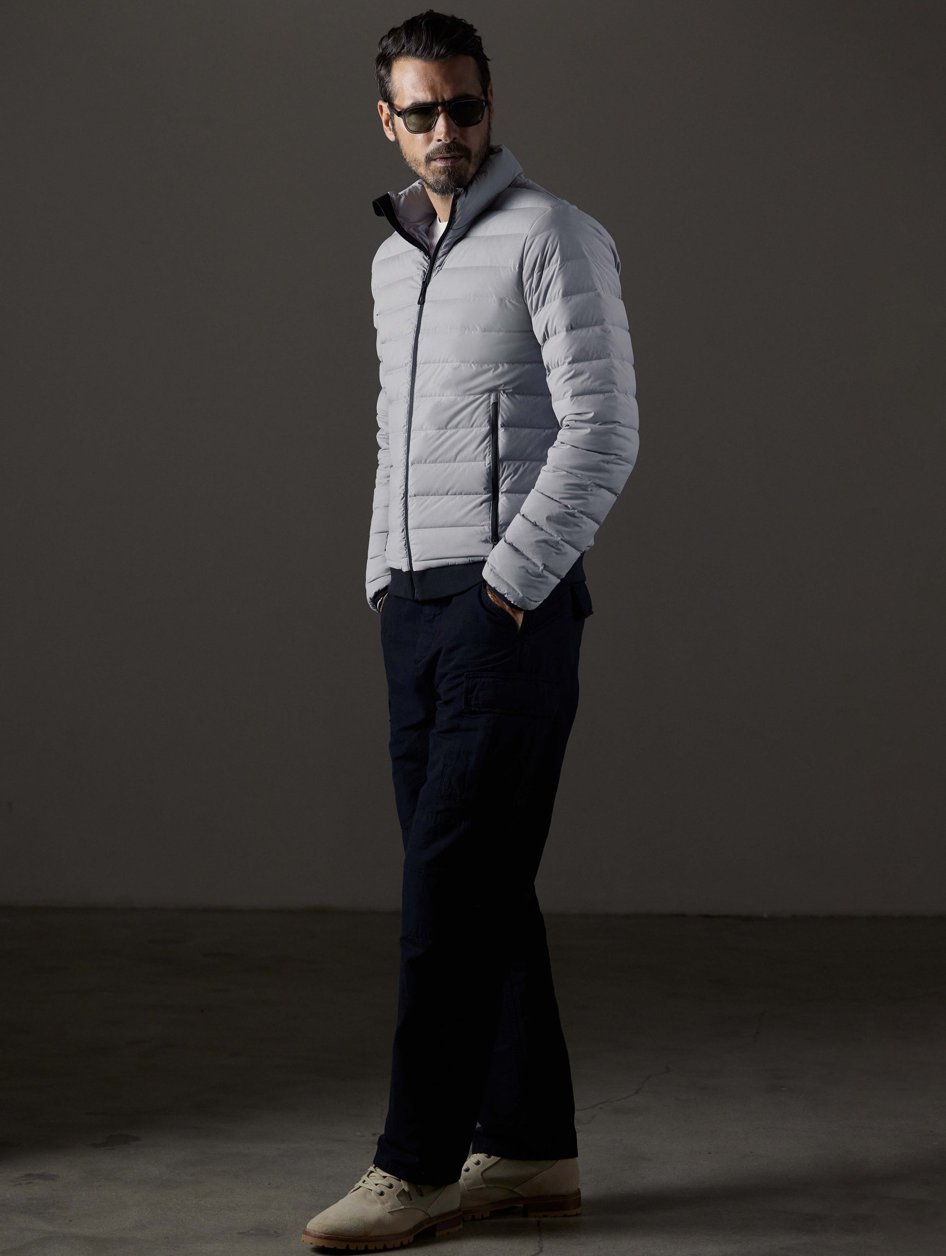 Front 3/4 full-body view of man wearing Launch Full-Zip Jacket NH in Sky Grey from AETHER Apparel.