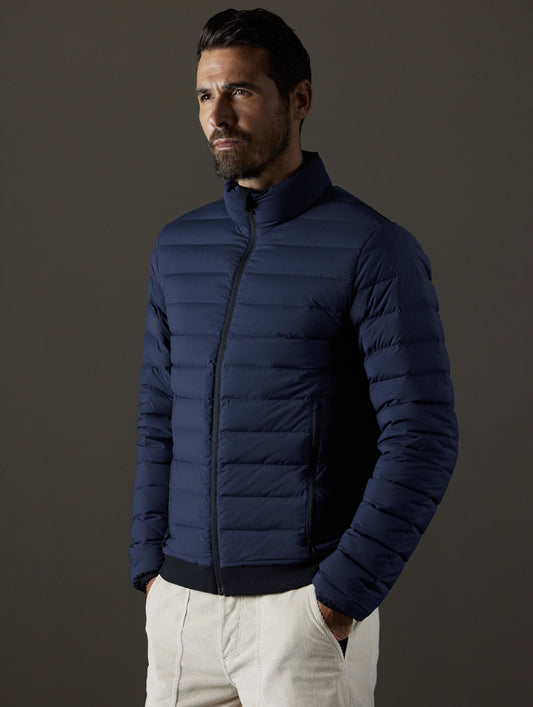 man wearing blue insulated jacket from AETHER Apparel