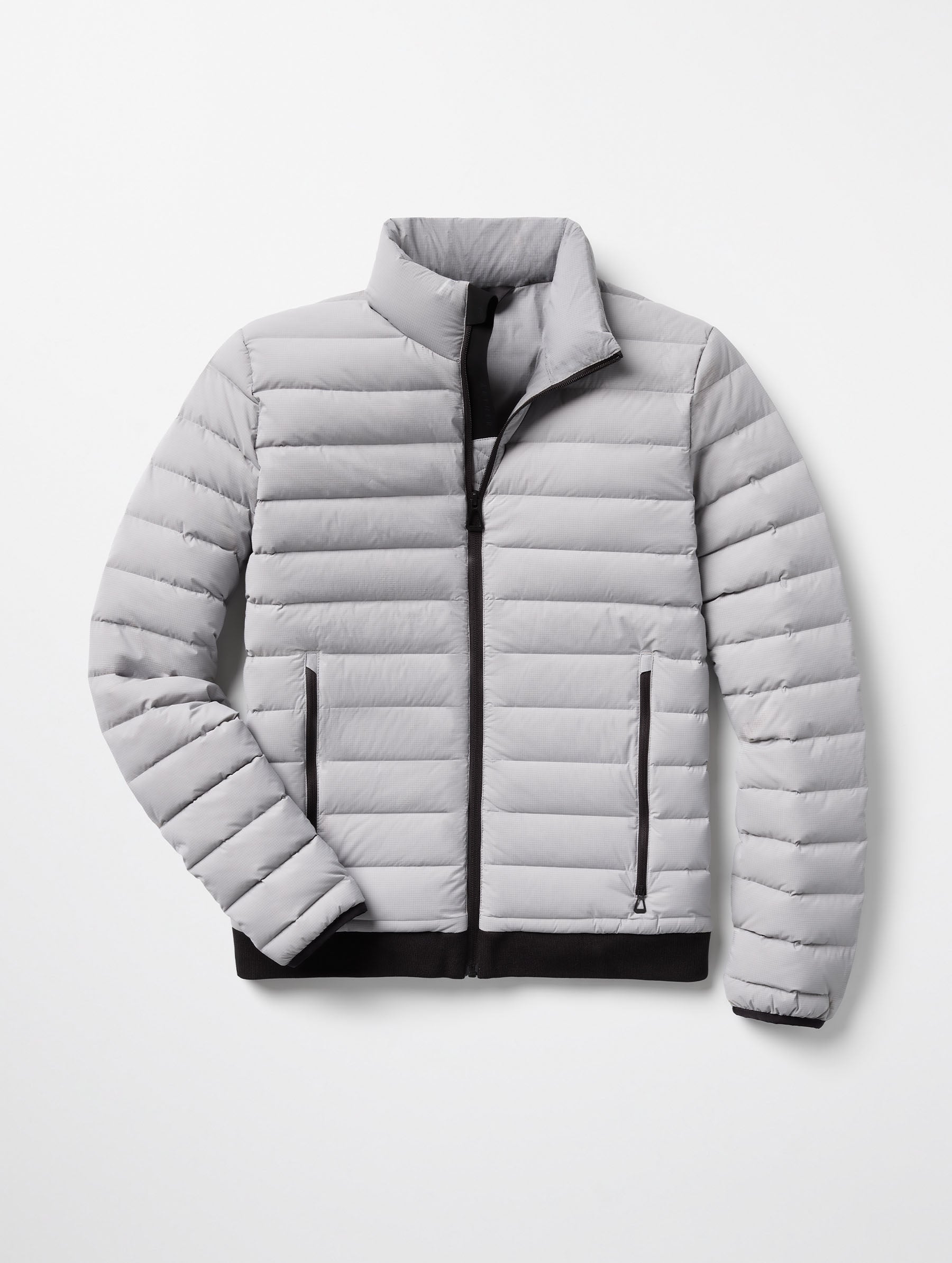 Flat lay of Launch Jacket in Sky Grey from AETHER Apparel.