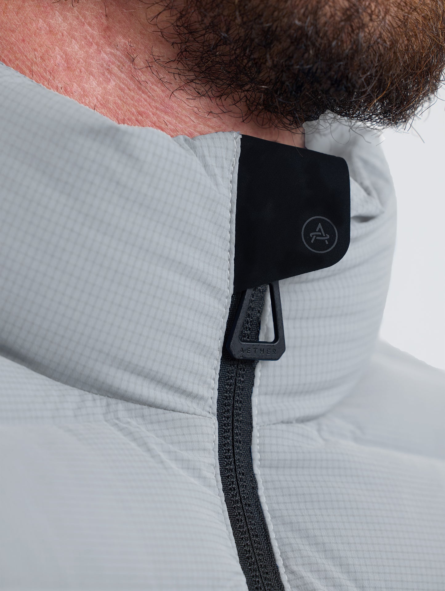 Closeup view of collar of Launch Jacket in Sky Grey from AETHER Apparel.