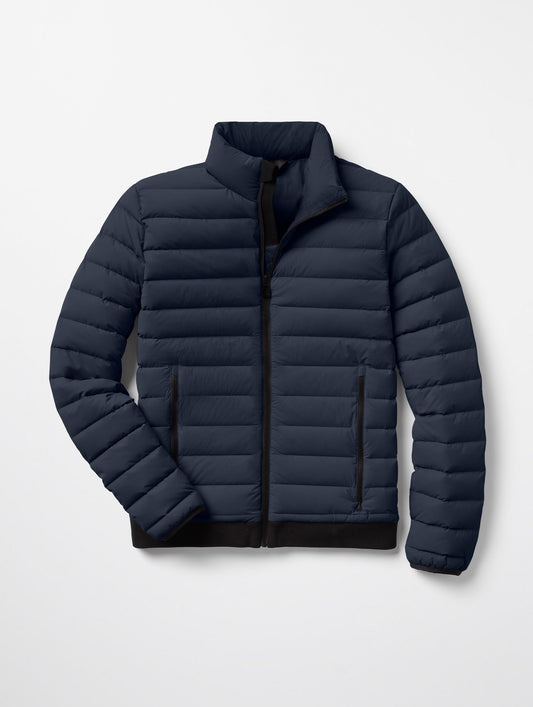 Flat lay of Launch Jacket in Total Eclipse dark blue from AETHER Apparel.