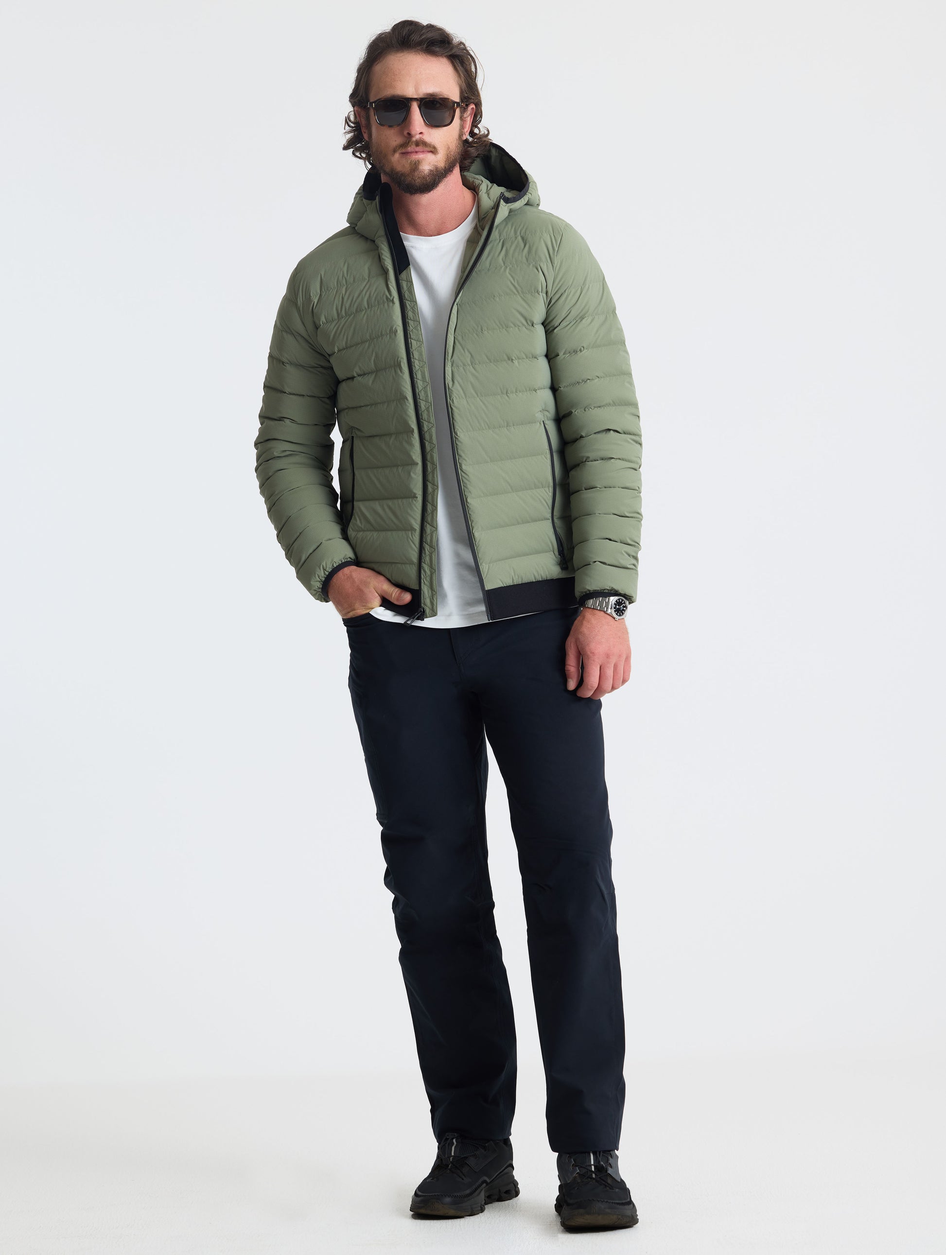Full body view of man wearing Launch Full-Zip Hooded Jacket in Fern Green from AETHER Apparel.