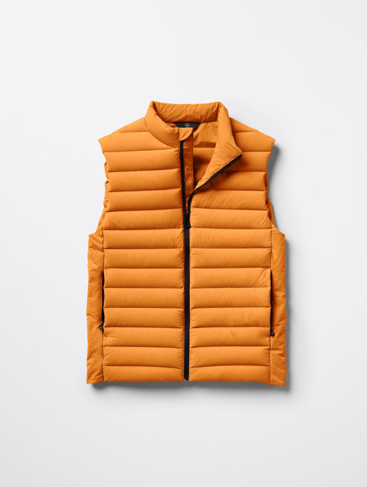 Flat lay of men's Launch Vest in Midas Orange from AETHER Apparel.