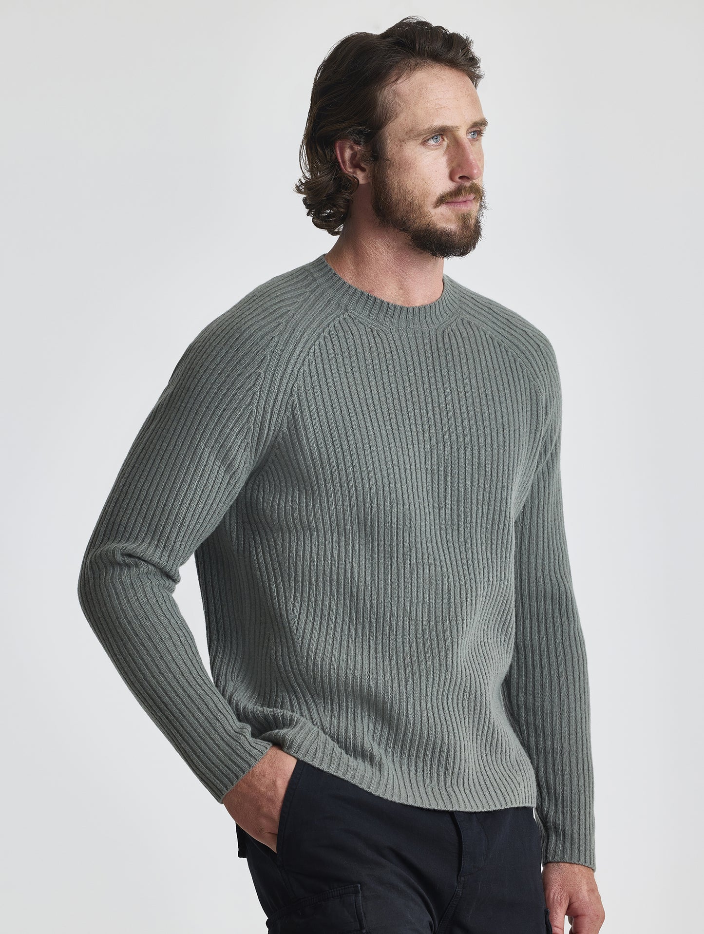 Angled front view of man wearing Lyon Sweater in Gunmetal grey from AETHER Apparel.