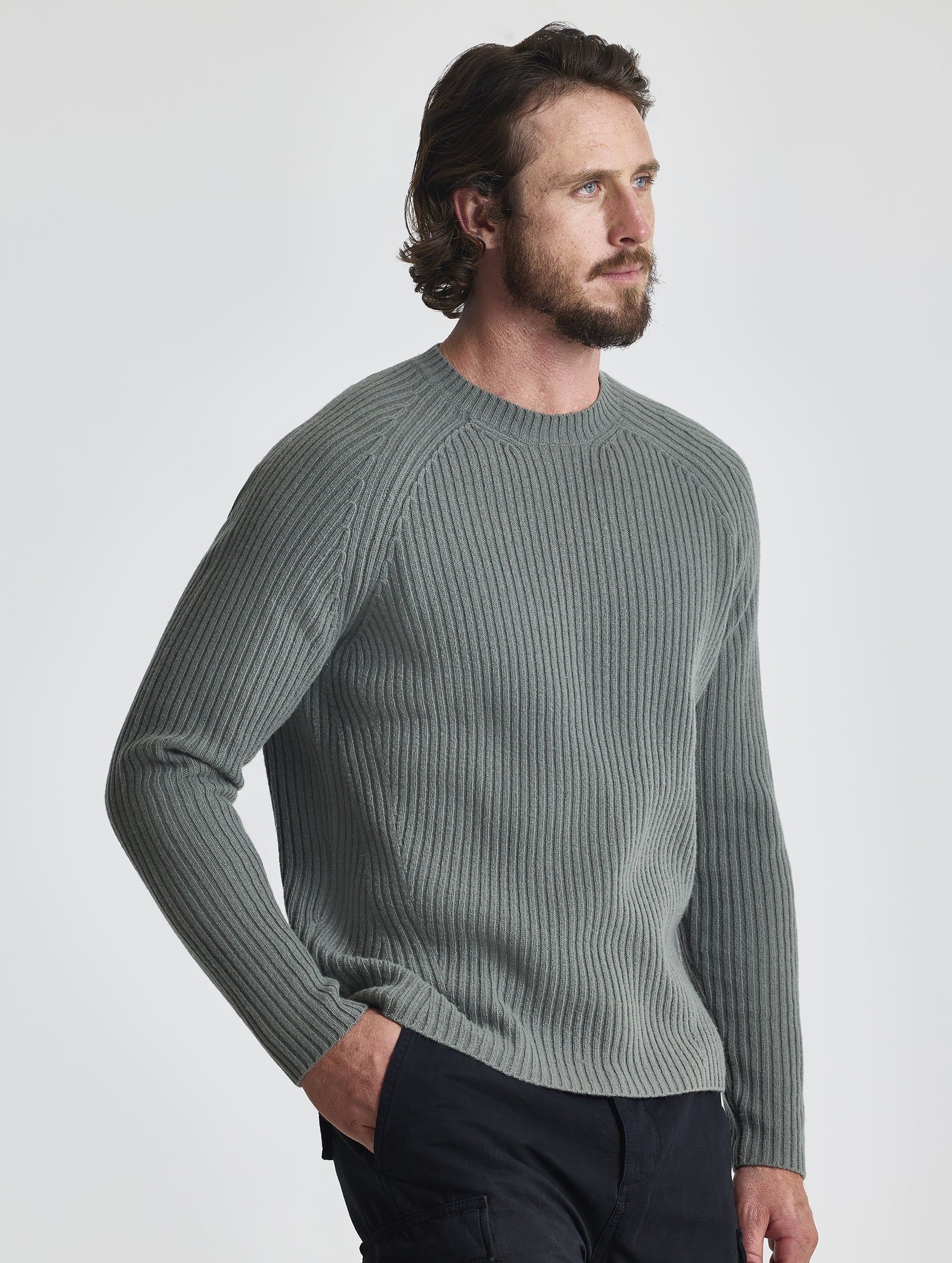 Angled front view of man wearing Lyon Sweater in Gunmetal grey from AETHER Apparel.