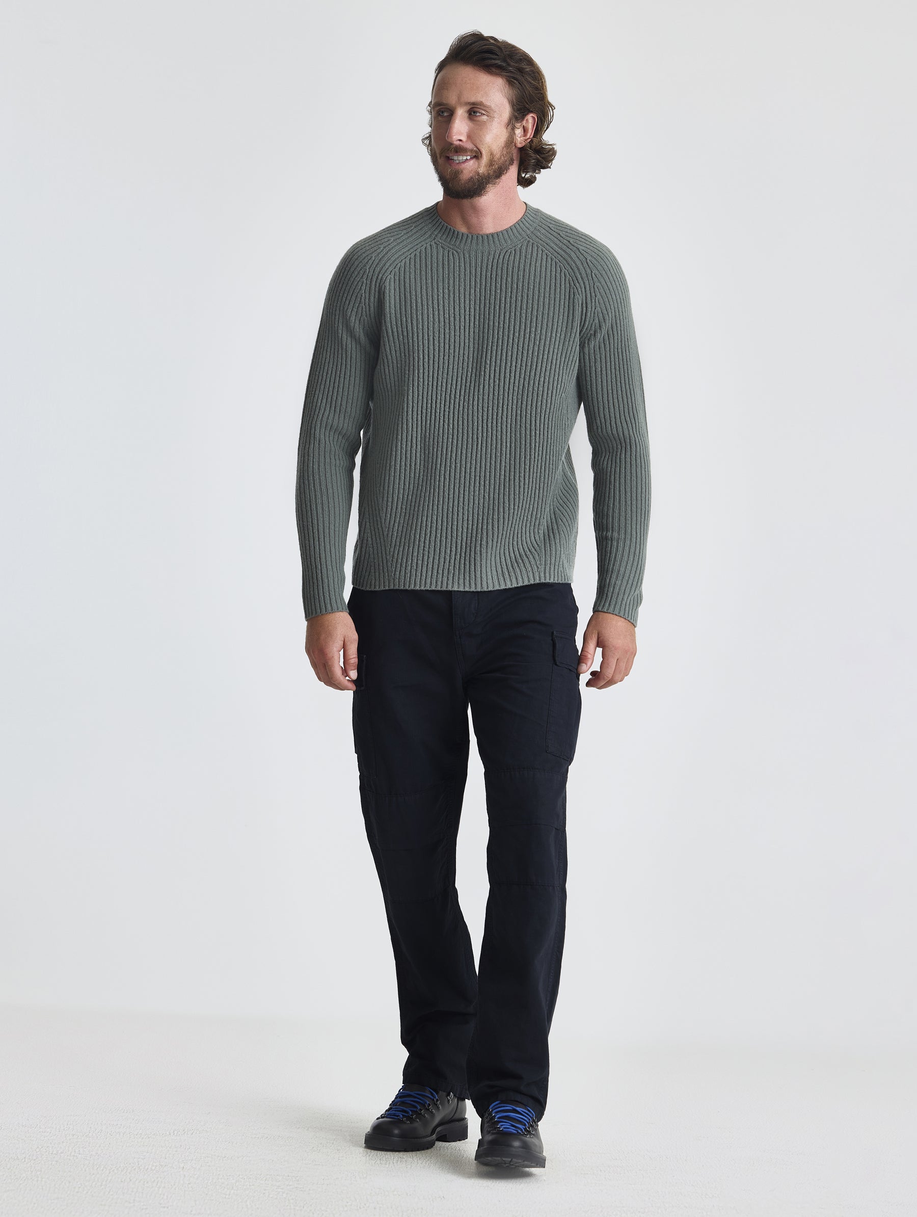 Full body view of man wearing Lyon Sweater in Gunmetal grey from AETHER Apparel.