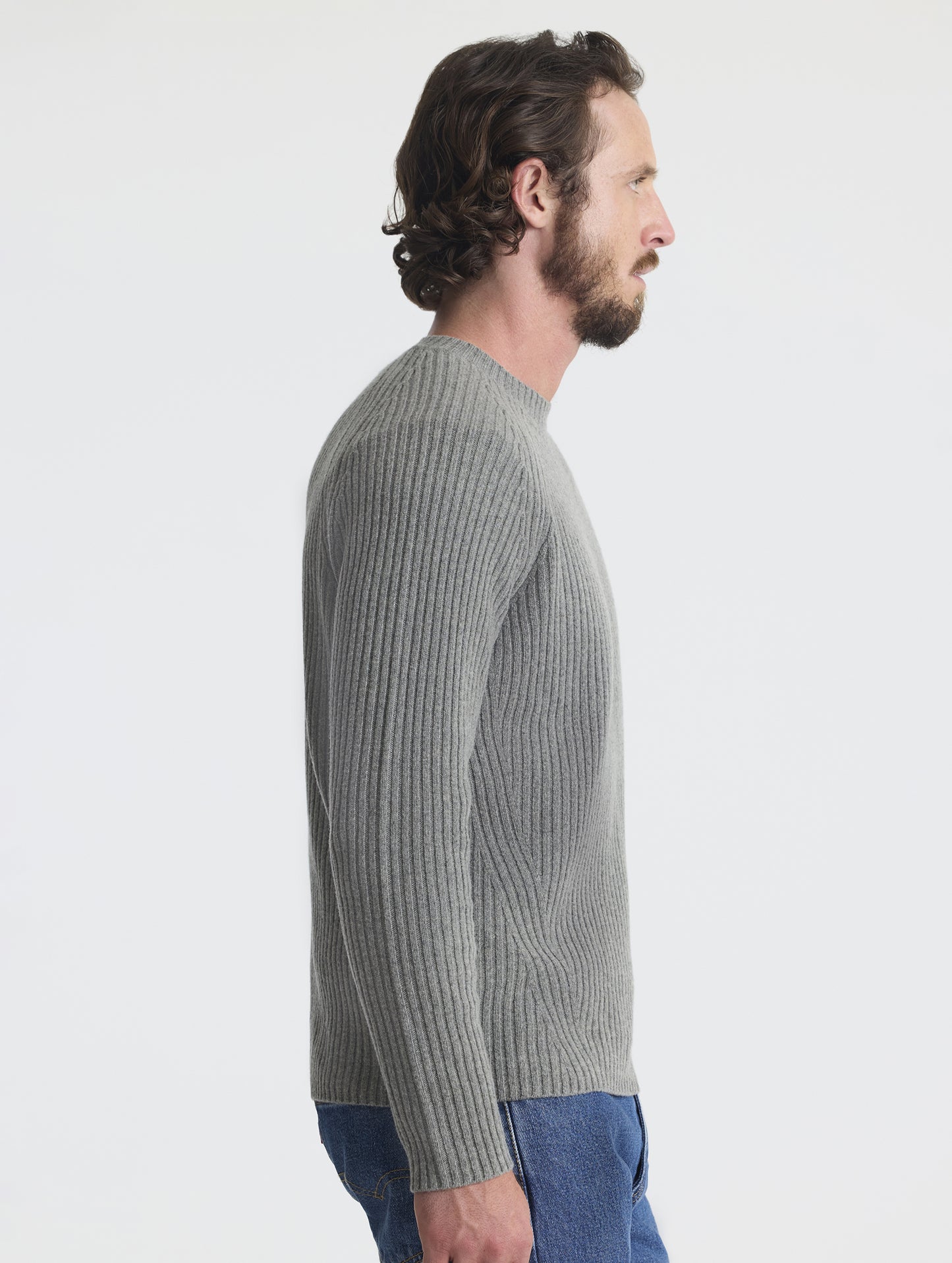 Right profile view of man wearing Lyon Sweater in Heather Grey from AETHER Apparel. 