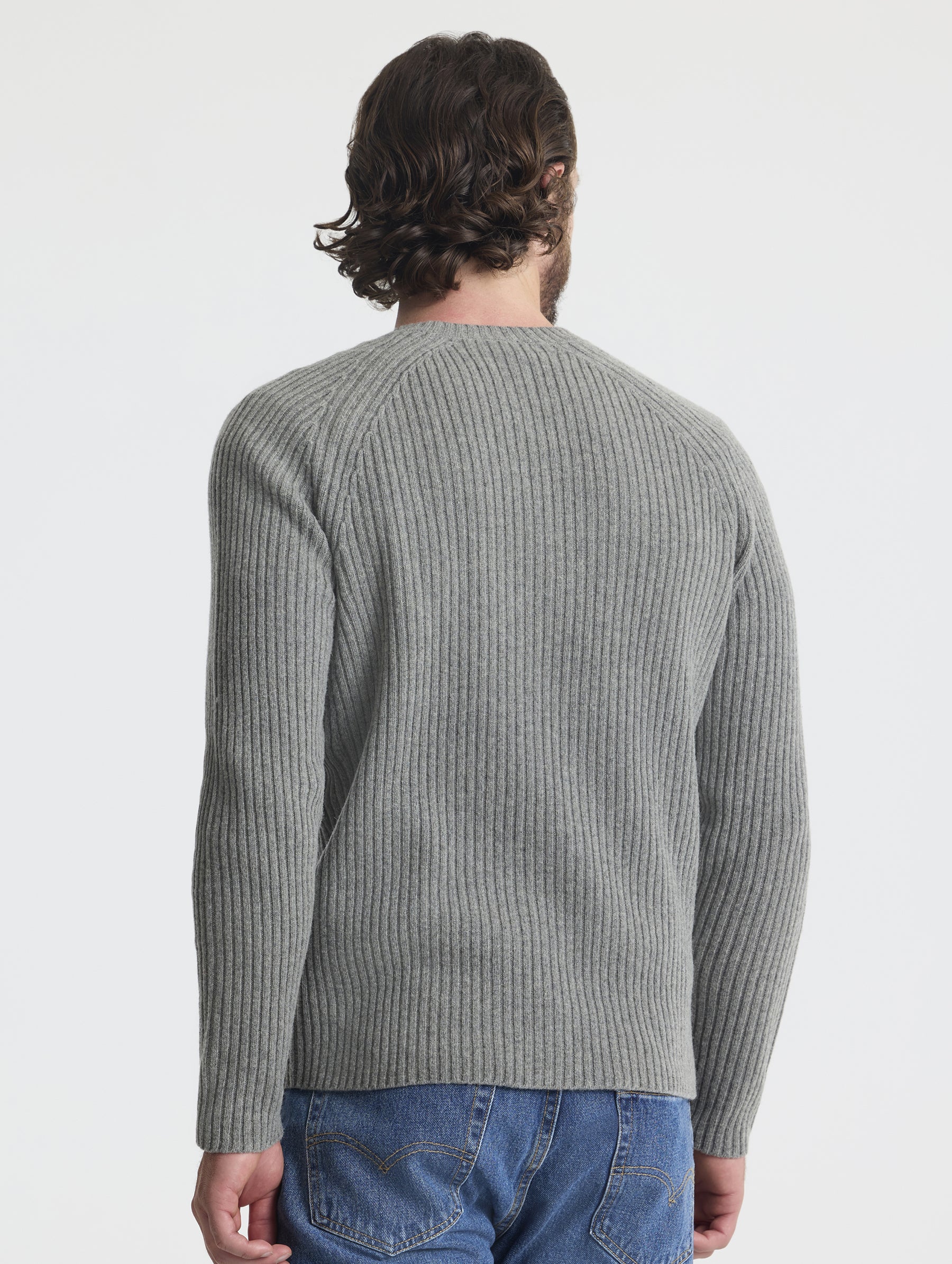 Rear view of man wearing Lyon Sweater in Heather Grey from AETHER Apparel. 