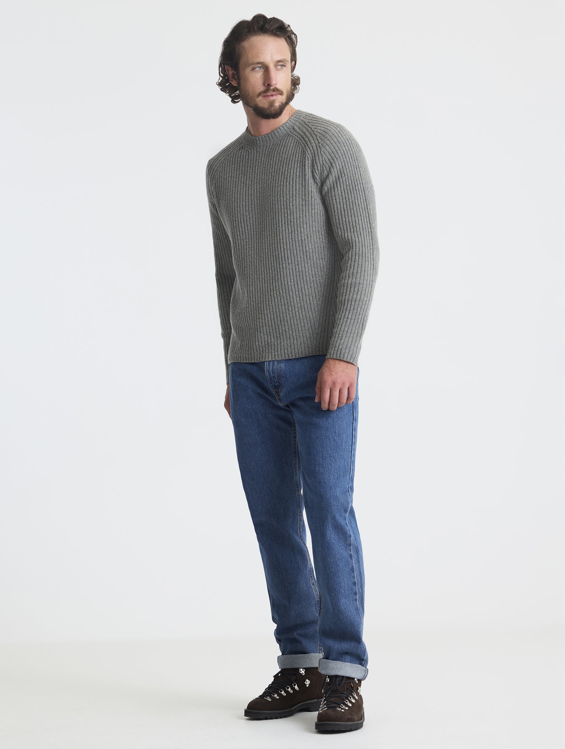 Full body view of man wearing Lyon Sweater in Heather Grey from AETHER Apparel. 