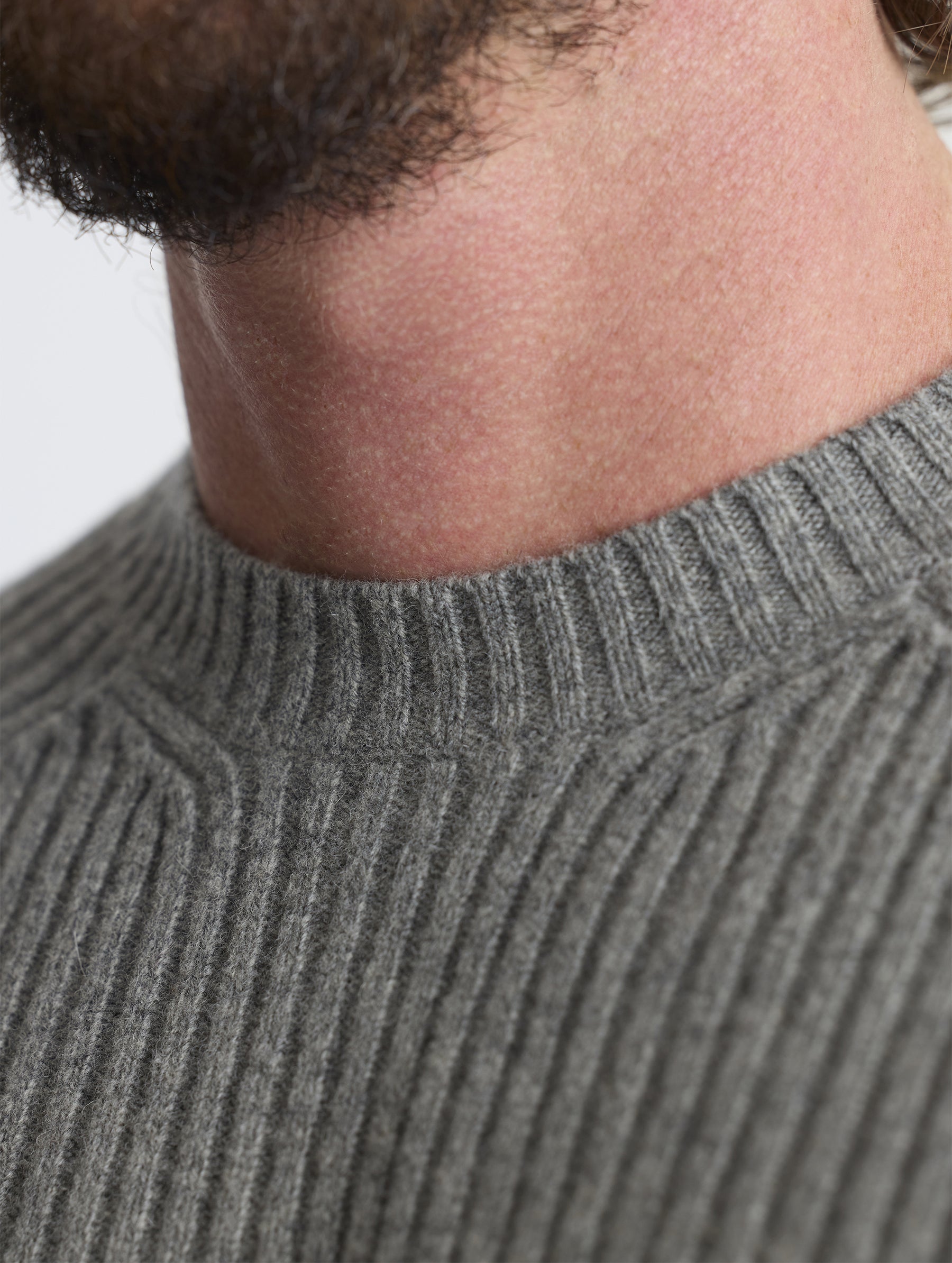 Closeup detail view of collar of Lyon Sweater in Heather Grey from AETHER Apparel. 