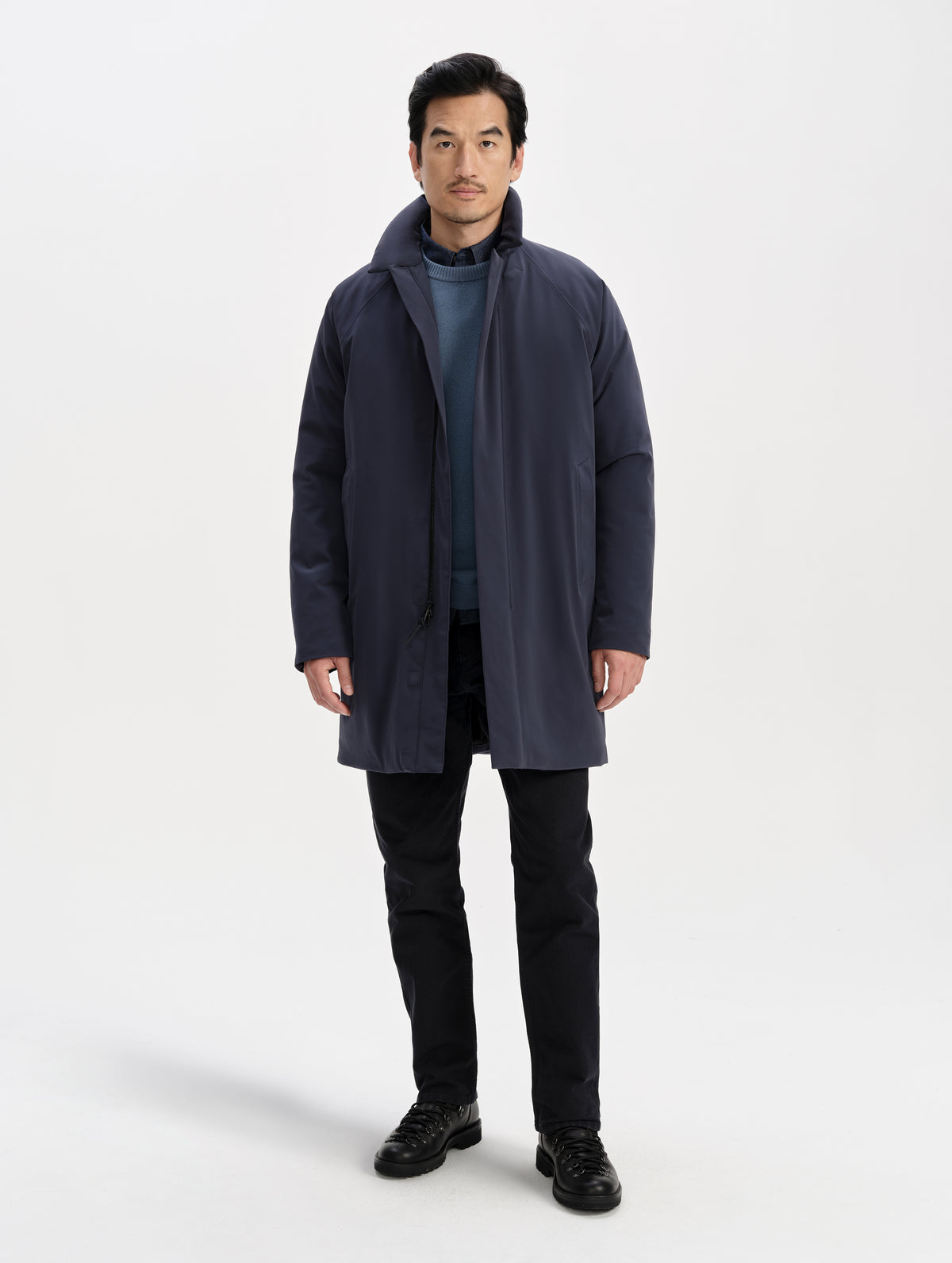 Front full-body view of man wearing the Maxwell Insulated Trench in Total Eclipse from AETHER Apparel unzipped. 