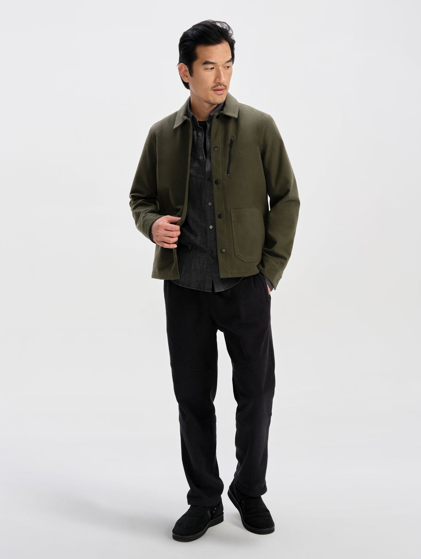 Front full-body view of man wearing the Milton Chore Jacket in Forest Green from AETHER Apparel.