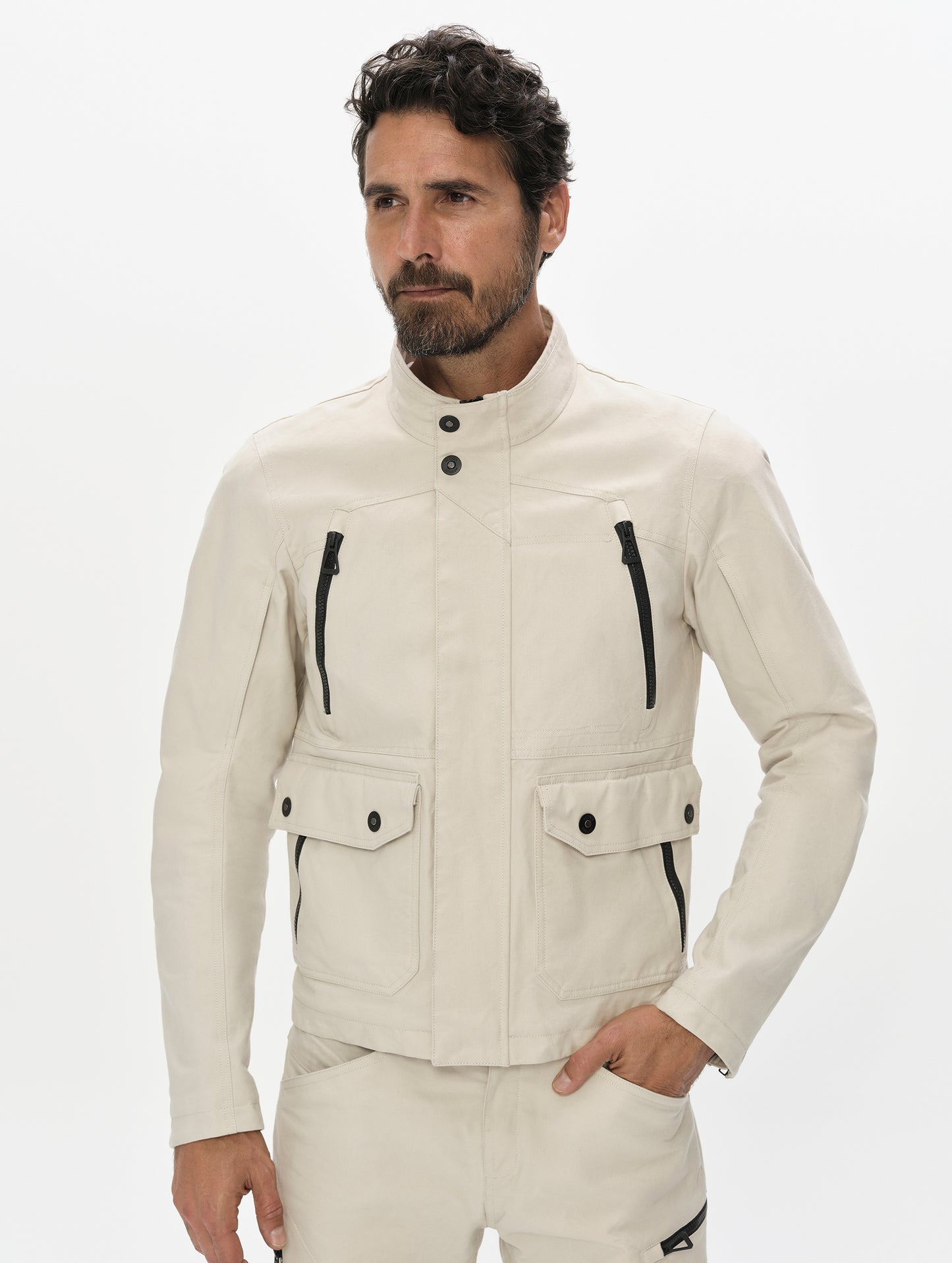 Front, upper-body view of man wearing the Mojave Motorcycle Jacket 2.0 in Bone from AETHER Apparel.