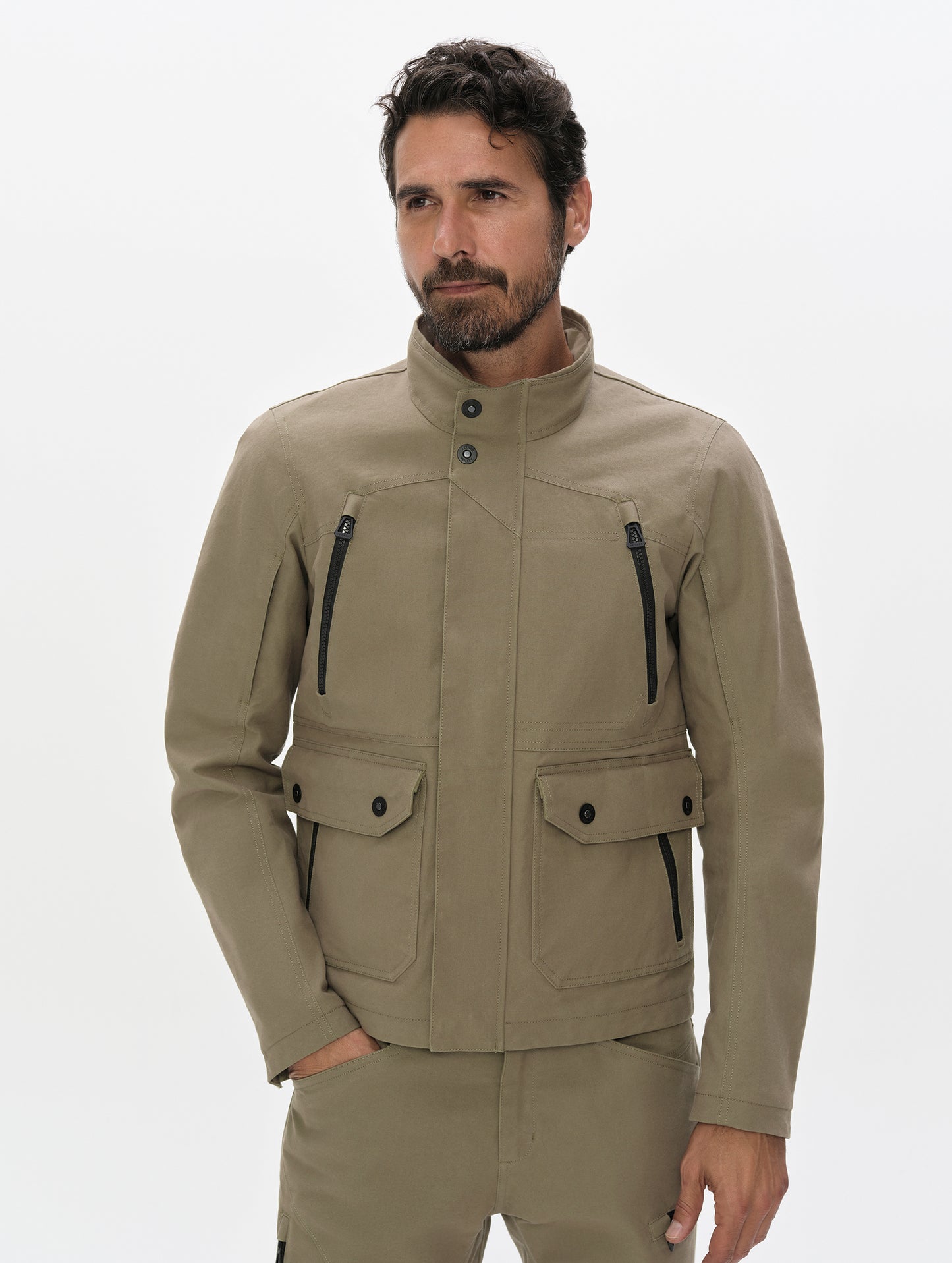 Front, upper-body view of man wearing the Mojave Motorcycle Jacket 2.0 in Stone Brown from AETHER Apparel.