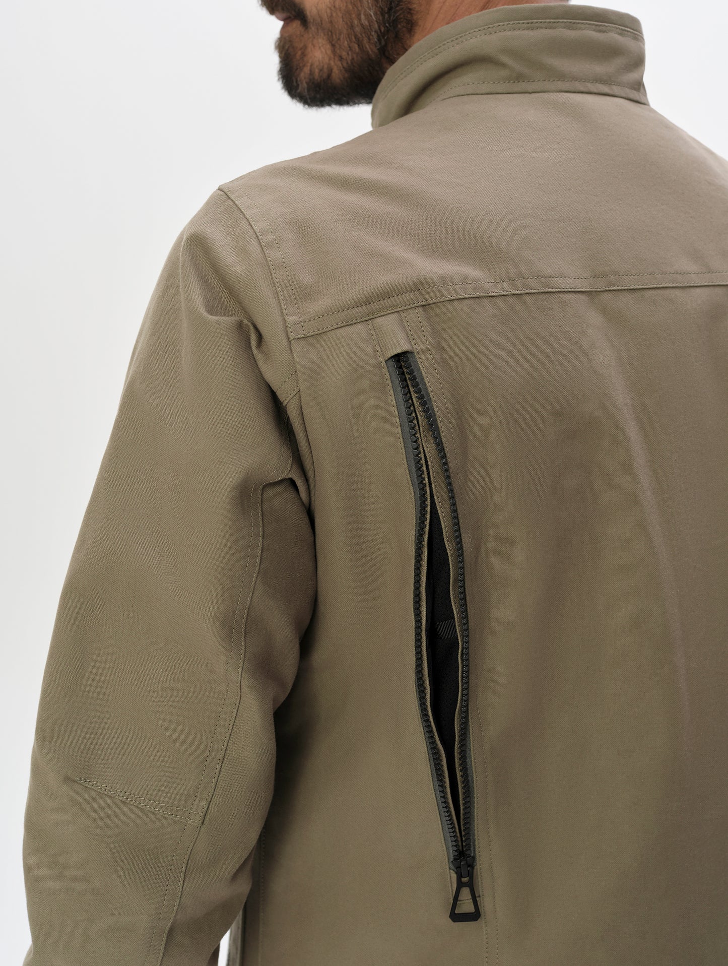 Closeup detailed view of the back vents on the Mojave Motorcycle Jacket 2.0 in Stone Brown from AETHER Apparel.