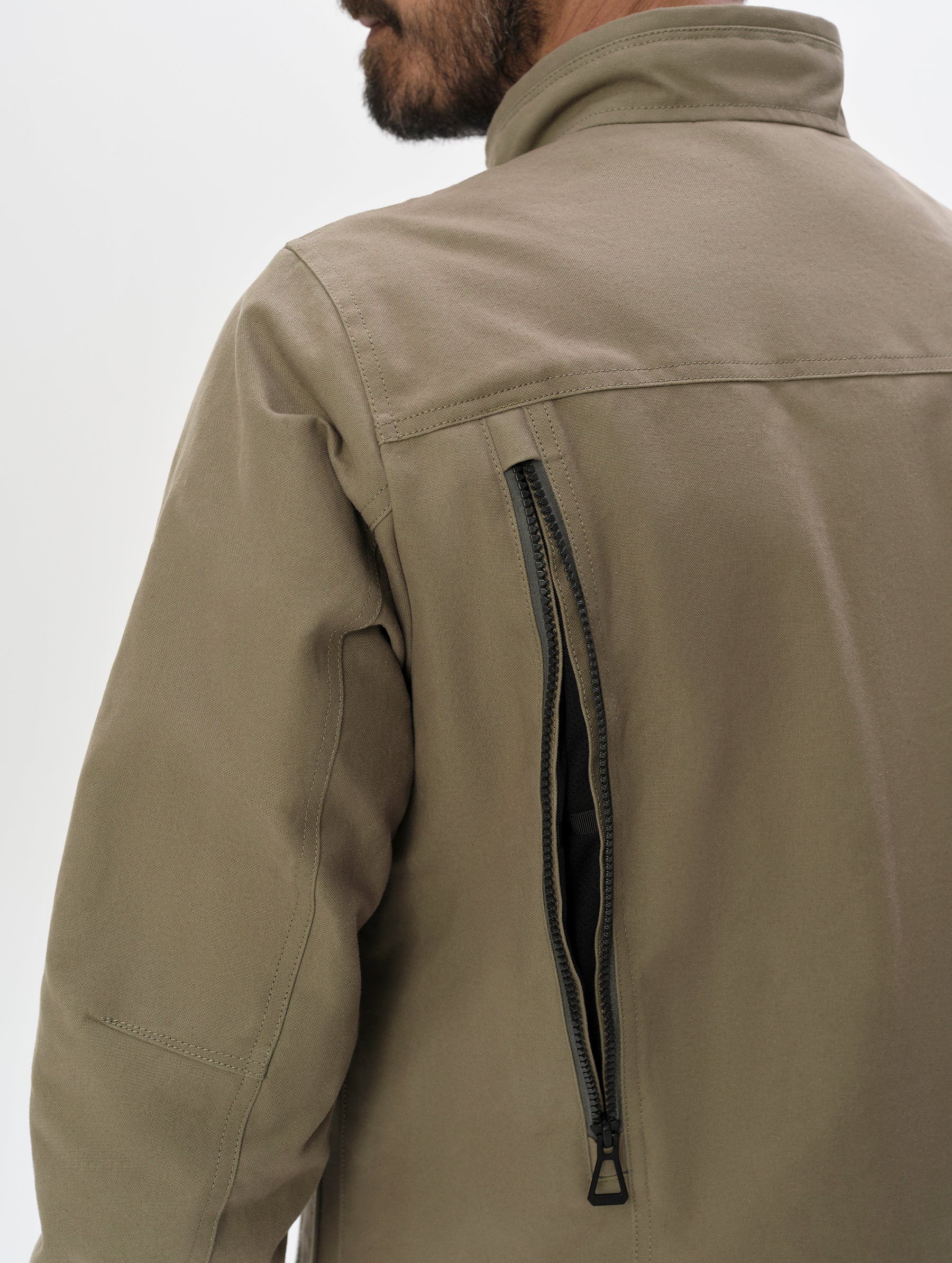 Closeup detailed view of the back vents on the Mojave Motorcycle Jacket 2.0 in Stone Brown from AETHER Apparel.