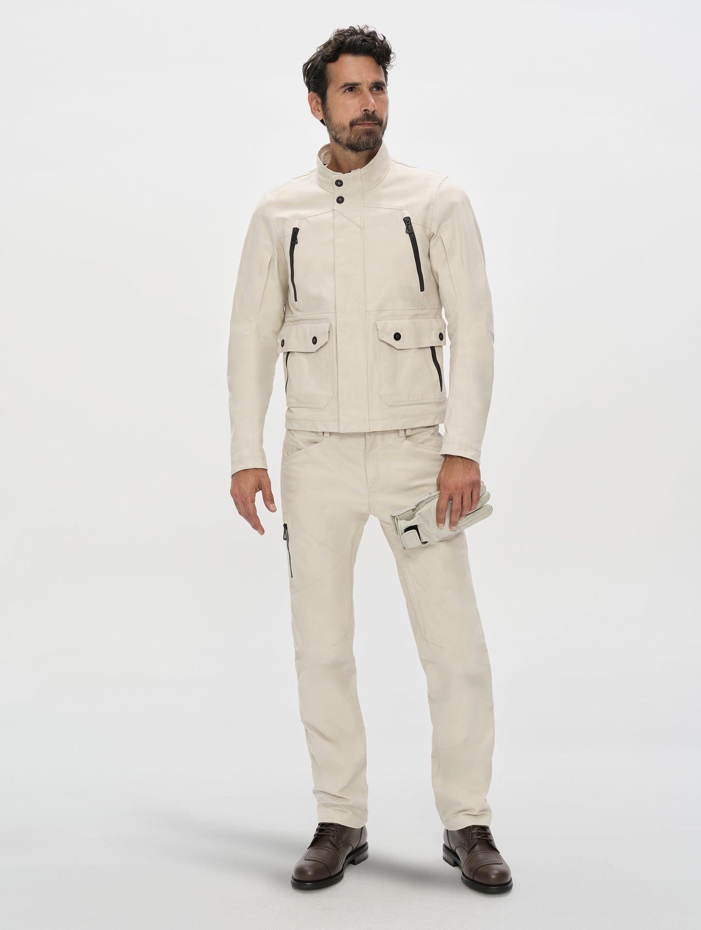 Front, full-body view of man wearing the Mojave Motorcycle Pant 2.0 and Mojave Motorcycle Jacket 2.0 in Bone from AETHER Apparel.