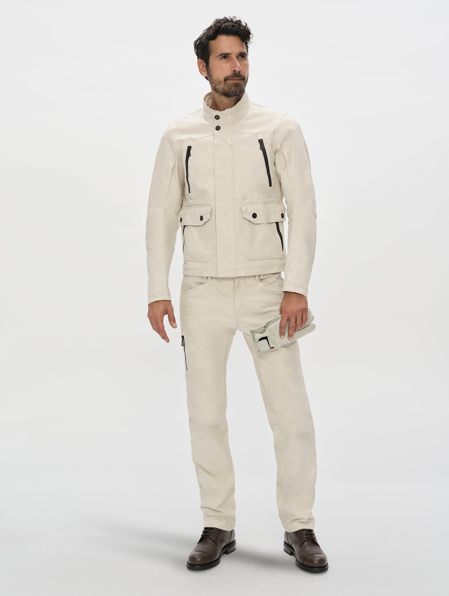 Front, full-body view of man wearing the Mojave Motorcycle Pant 2.0 and Mojave Motorcycle Jacket 2.0 in Bone from AETHER Apparel.