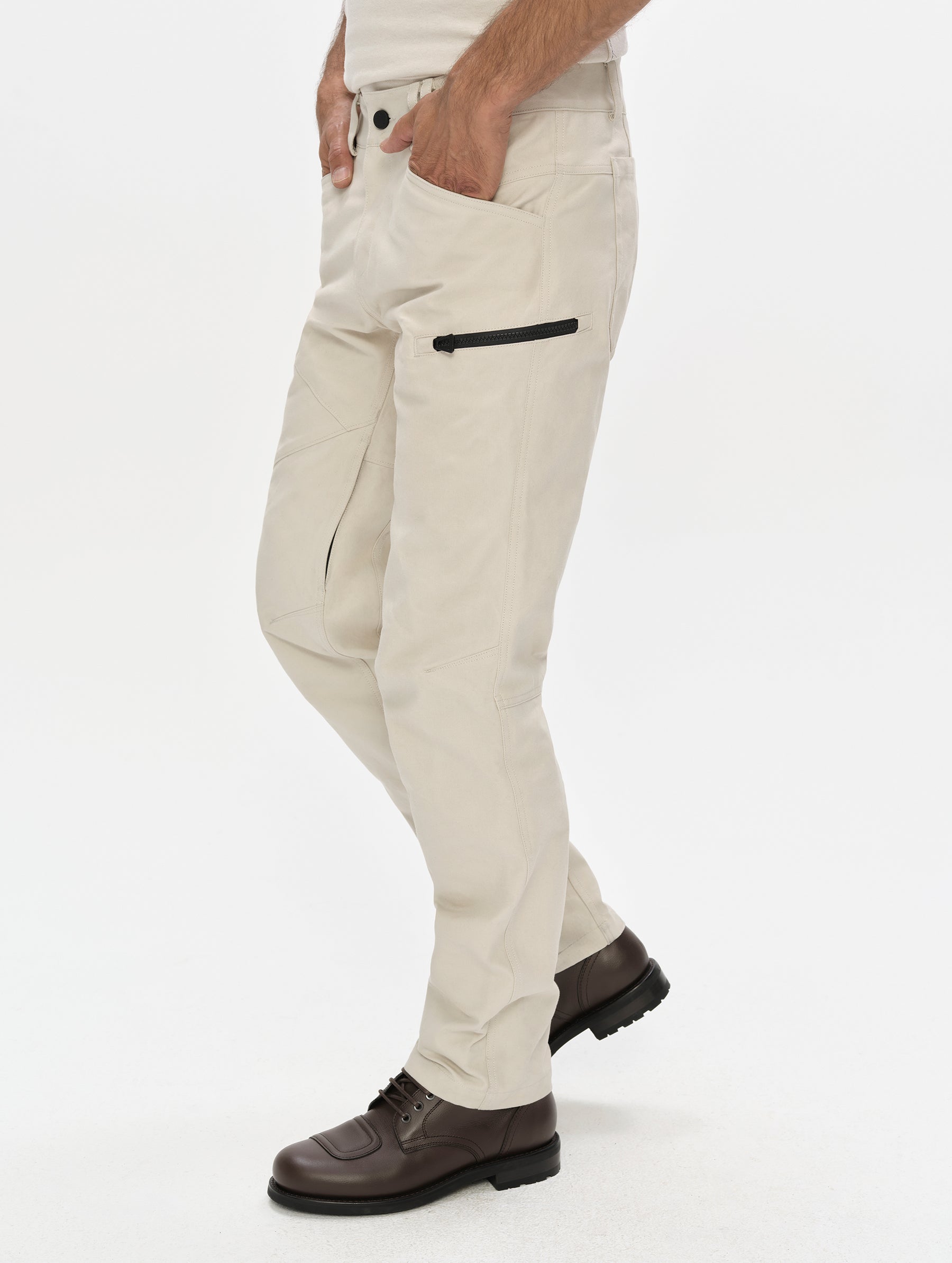Side profile, lower-body view of man wearing the Mojave Motorcycle Pant 2.0 in Bone from AETHER Apparel.