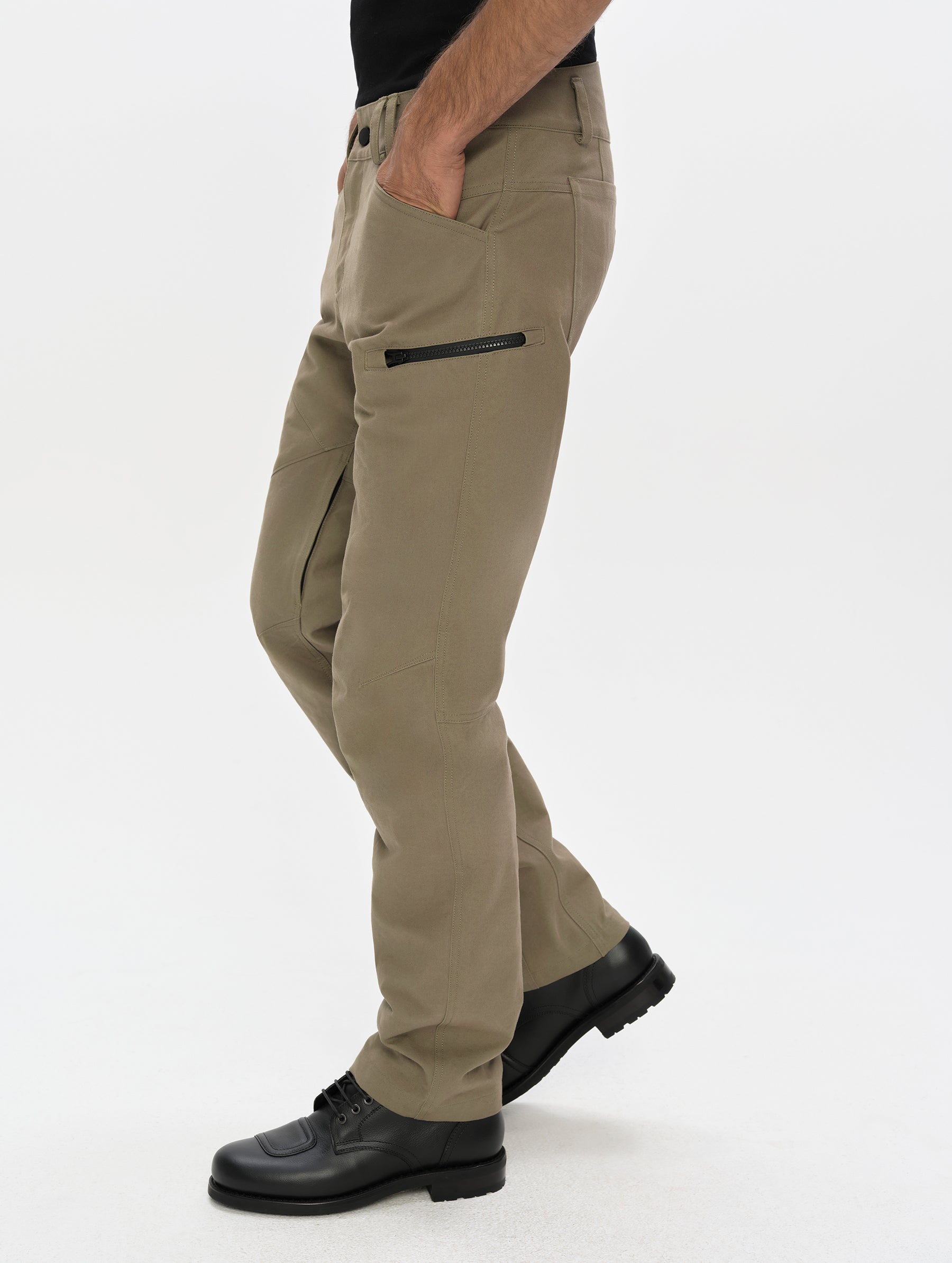 Side profile, lower-body view of man wearing the Mojave Motorcycle Pant 2.0 in Stone Brown from AETHER Apparel.
