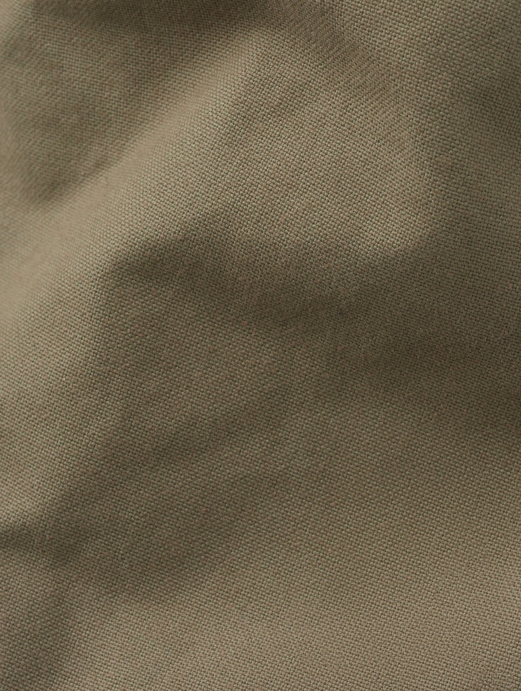 Closeup detailed view of the heavy-duty cotton canvas construction on Mojave Motorcycle Pant 2.0 in Stone Brown from AETHER Apparel.
