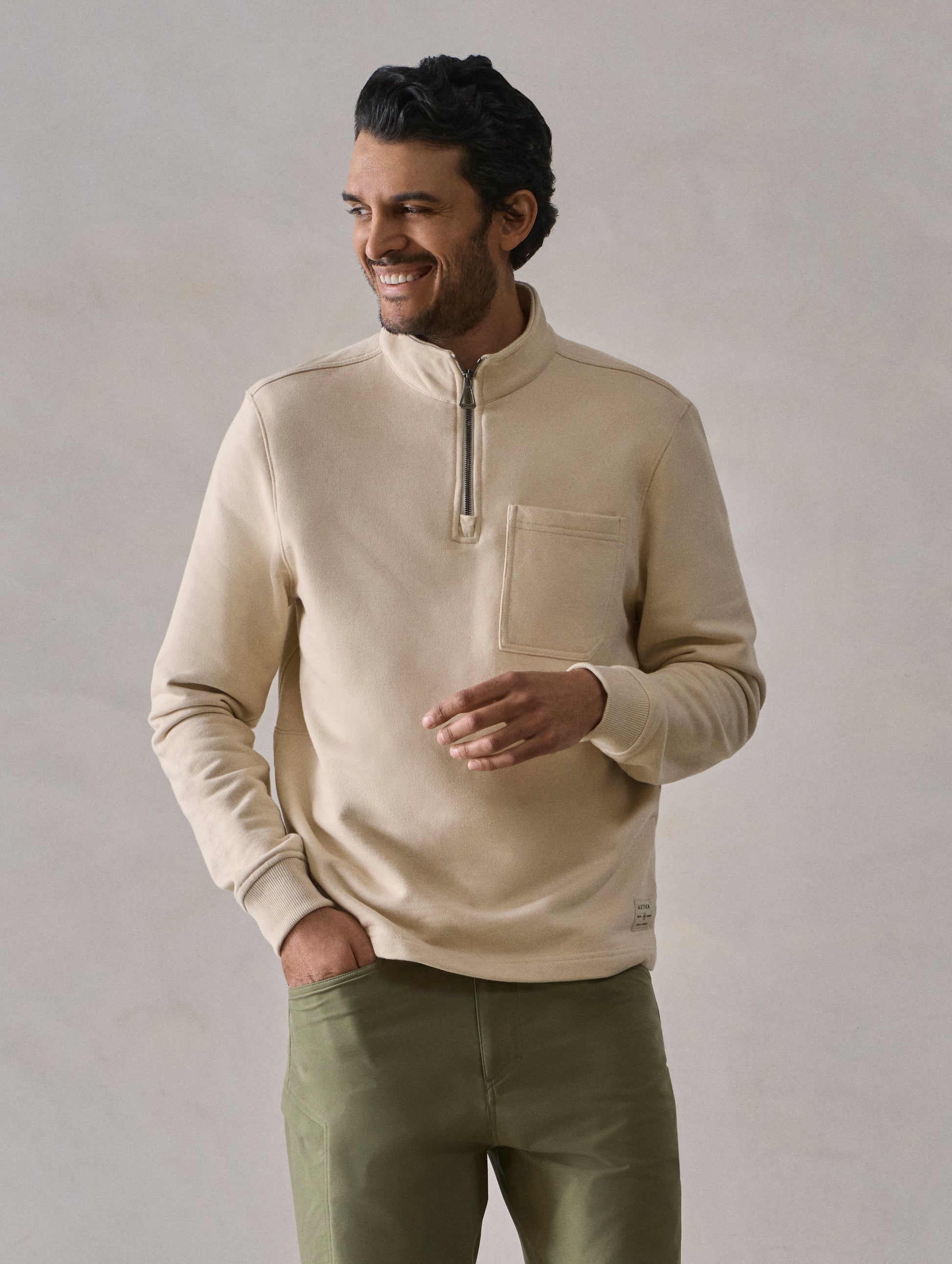 Front body view of man wearing Monte Half-Zip Sweatshirt in Bone white from AETHER Apparel.