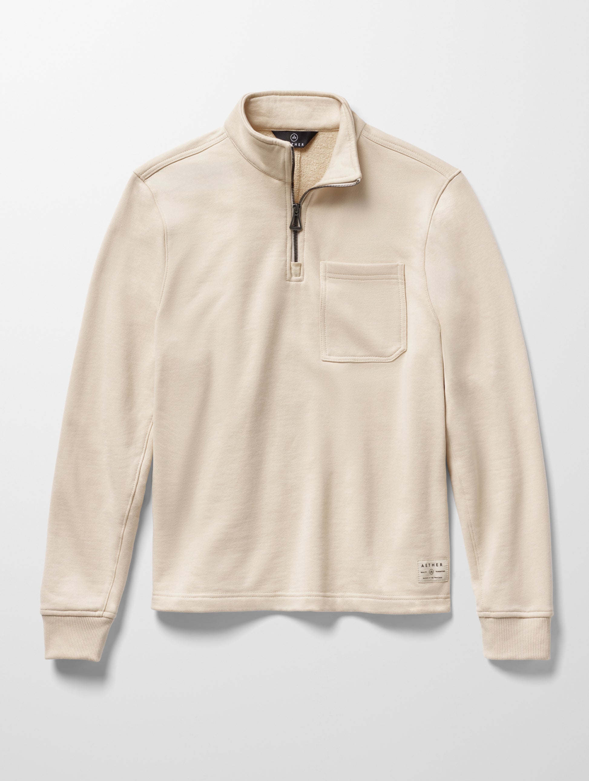 Flat lay image of men's Monte Half-Zip Sweatshirt in Bone white from AETHER Apparel.