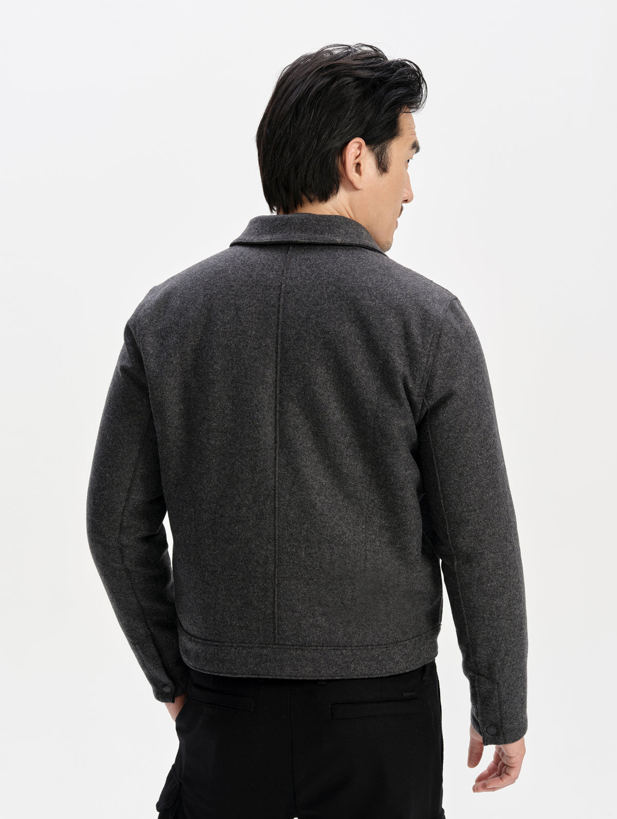 Rear upper-body view of man wearing the Monza Wool Jacket 2.0 in Charcoal Grey from AETHER Apparel.