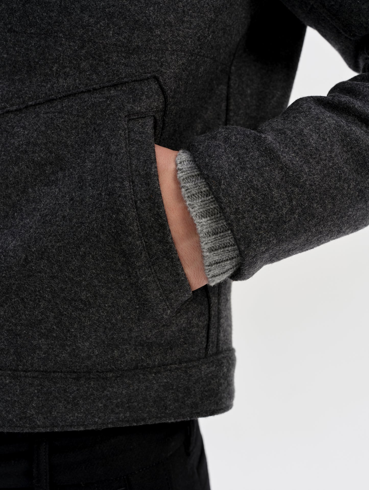 Closeup detailed view of the inset hand pockets with welt openings on the Monza Wool Jacket 2.0 in Charcoal Grey from AETHER Apparel.