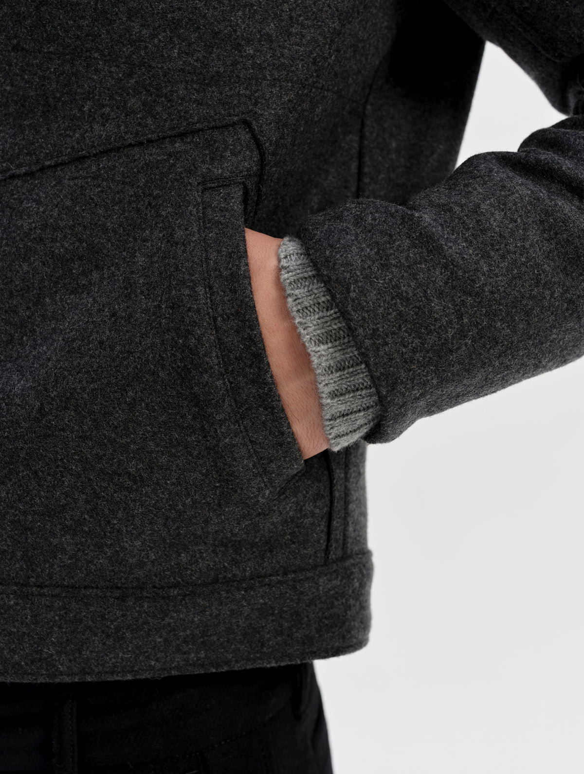 Closeup detailed view of the inset hand pockets with welt openings on the Monza Wool Jacket 2.0 in Charcoal Grey from AETHER Apparel.