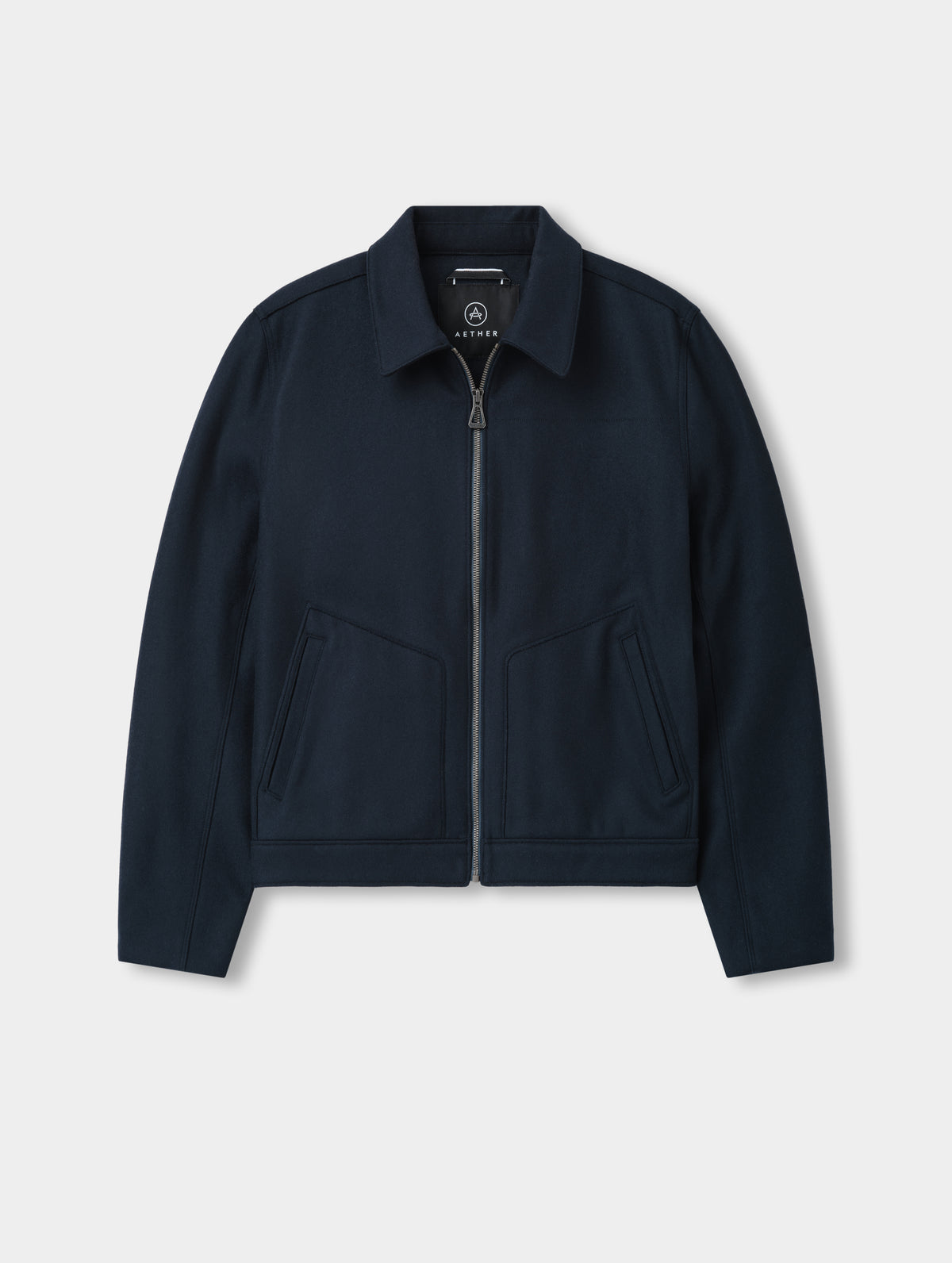 Flat lay of the Monza Wool Jacket 2.0 in Total Eclipse from AETHER Apparel.