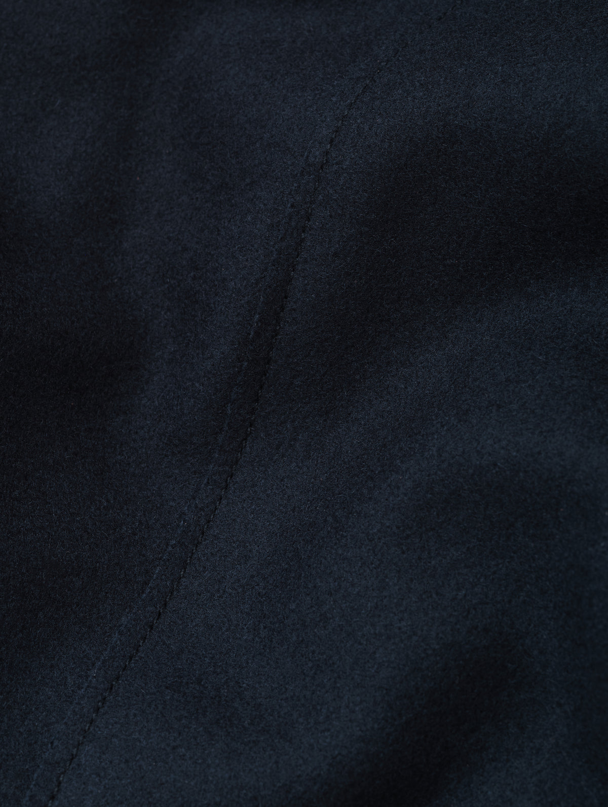 Closeup detailed view of the recycled wool blend fabric construction on the Monza Wool Jacket 2.0 in Total Eclipse from AETHER Apparel.