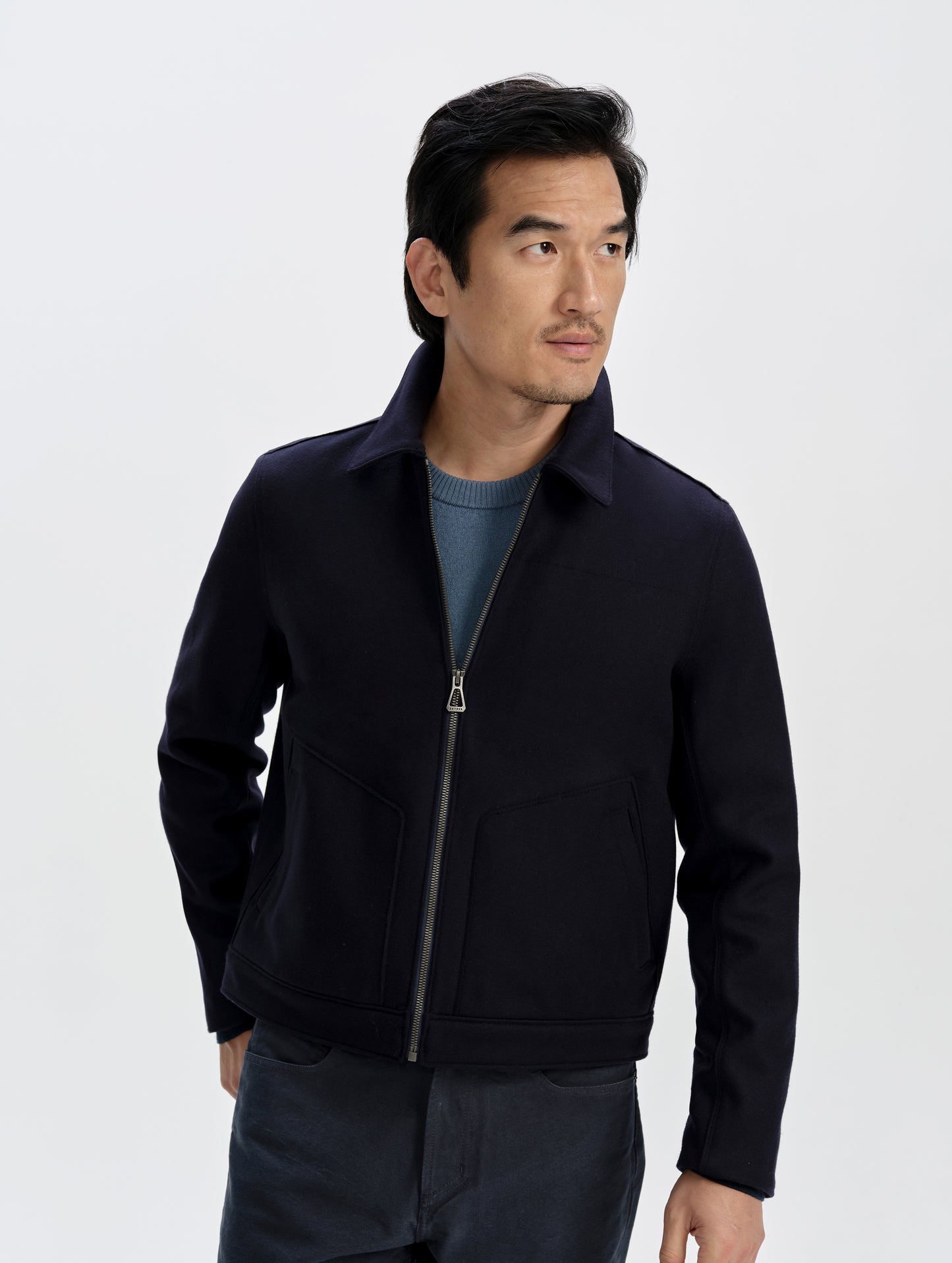 Front upper-body view of man wearing the Monza Wool Jacket 2.0 in Total Eclipse from AETHER Apparel.