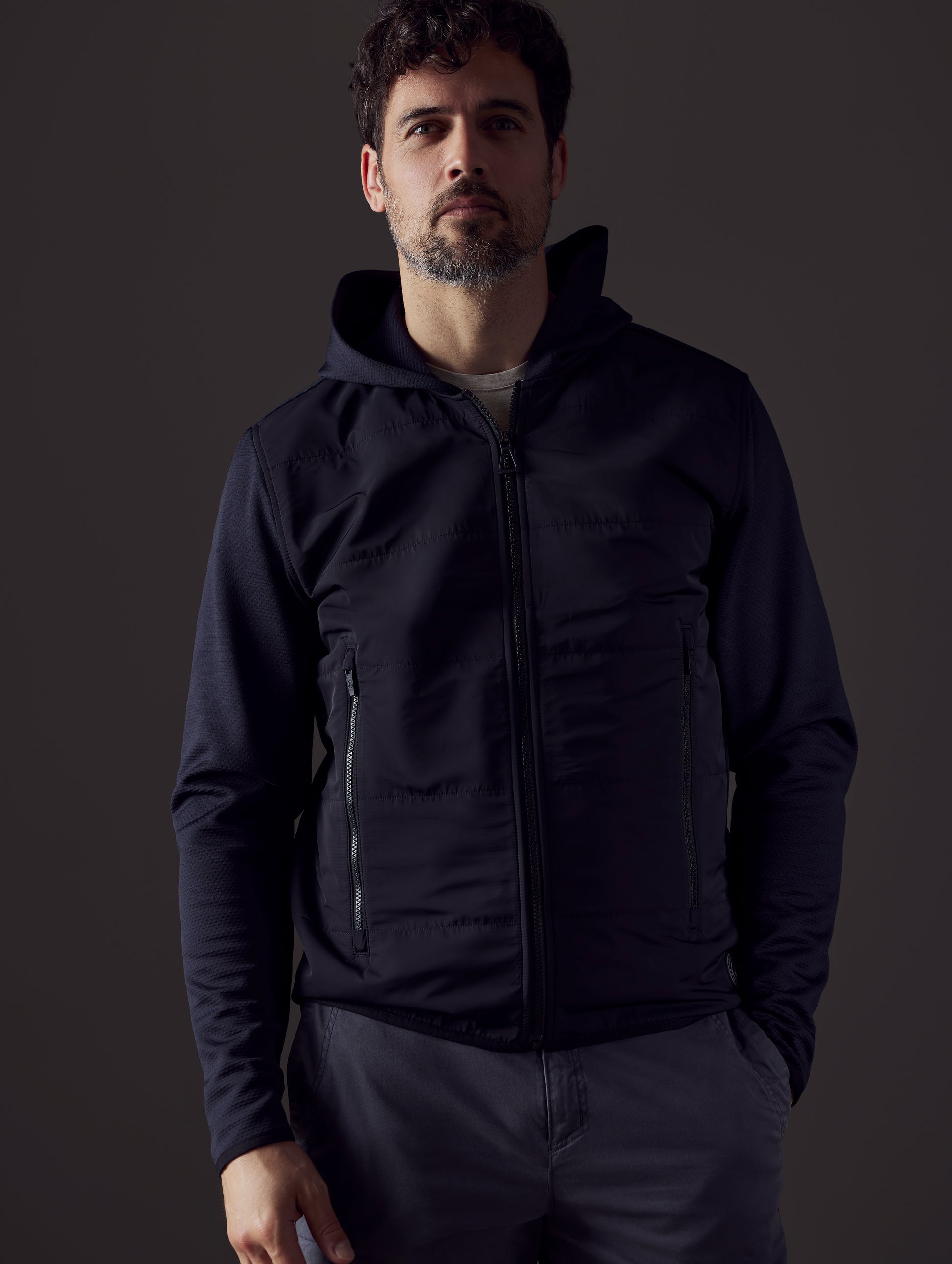 Man wearing black full-zip from AETHER Apparel