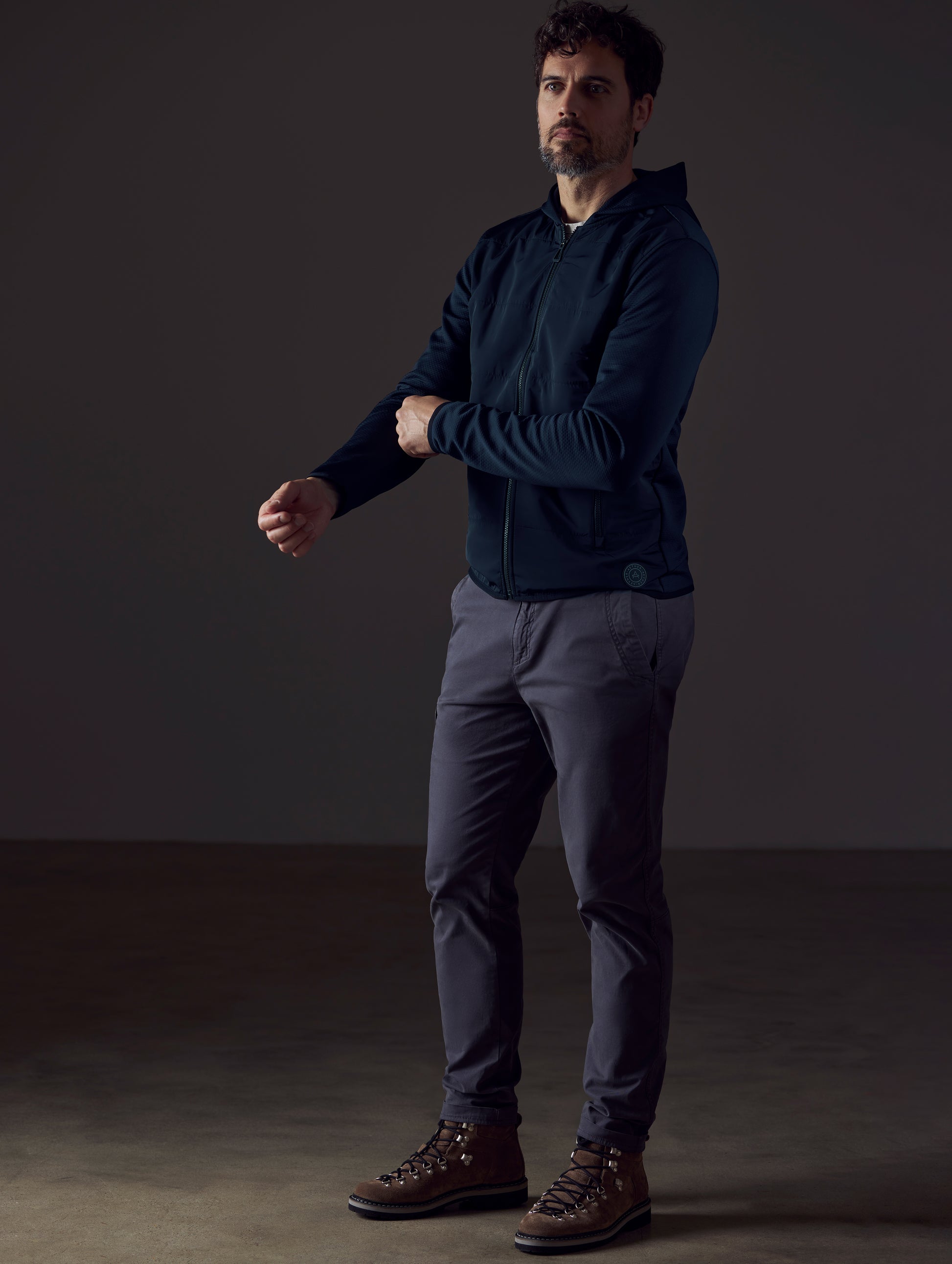 Man wearing dark blue full-zip from AETHER Apparel