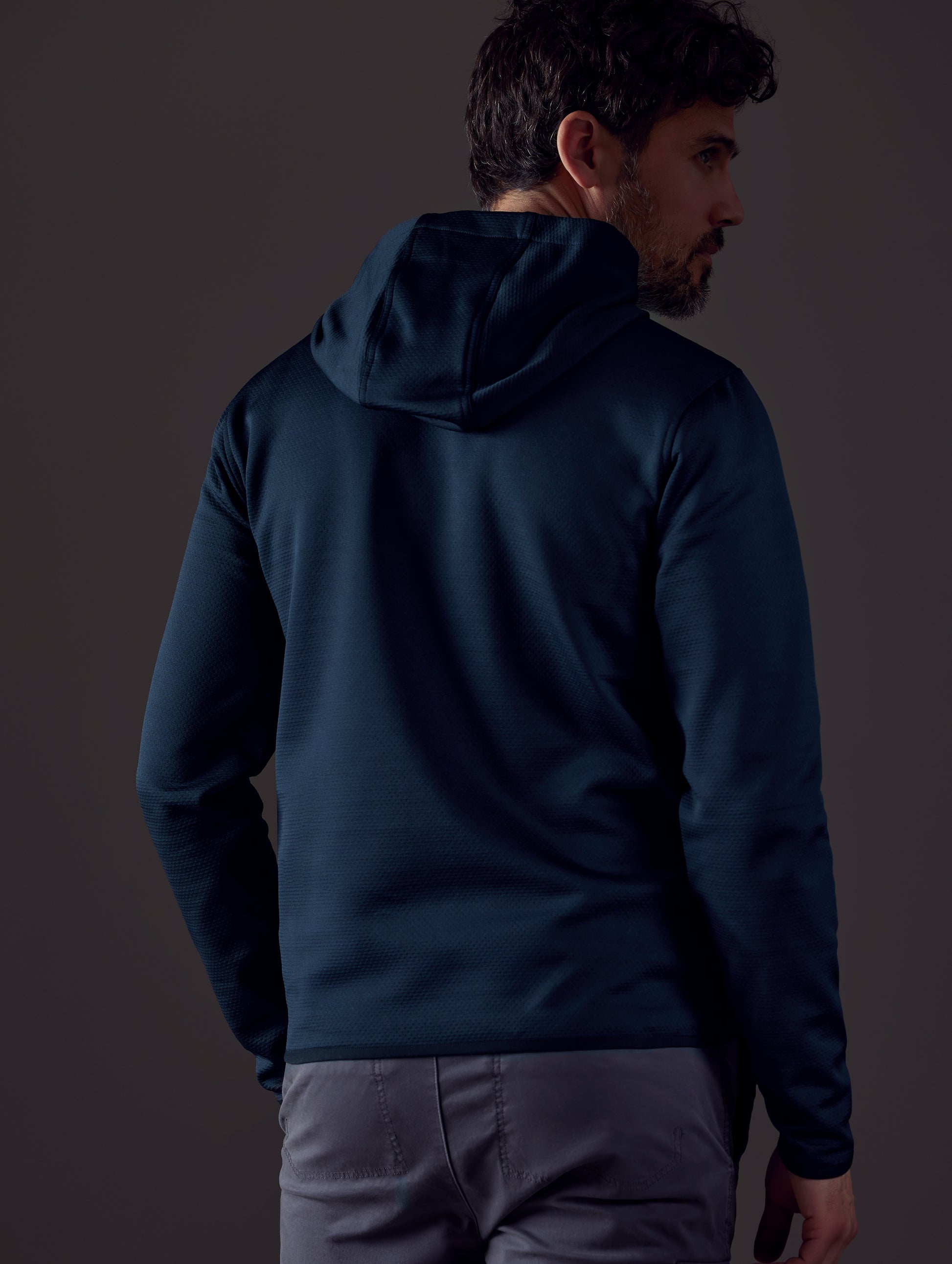 Man wearing dark blue full-zip from AETHER Apparel