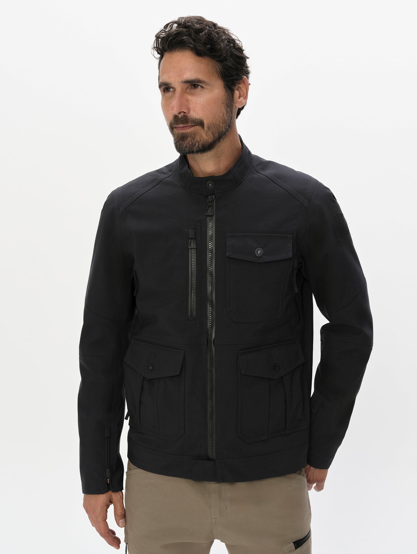 Front, upper-body view of man wearing the Mulholland Motorcycle Jacket Special Edition in Onyx Black from AETHER Apparel.