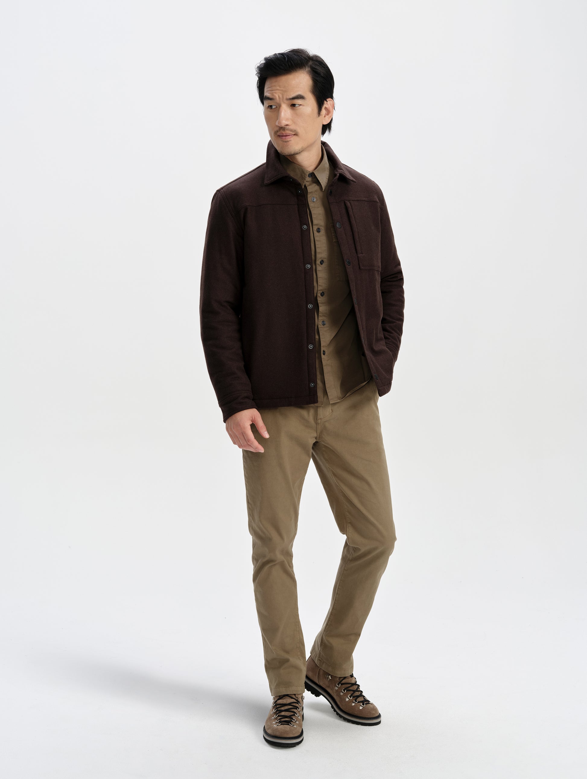 Front full-body view of man wearing the Nova Insulated Button-Down in Ash Brown from AETHER Apparel.