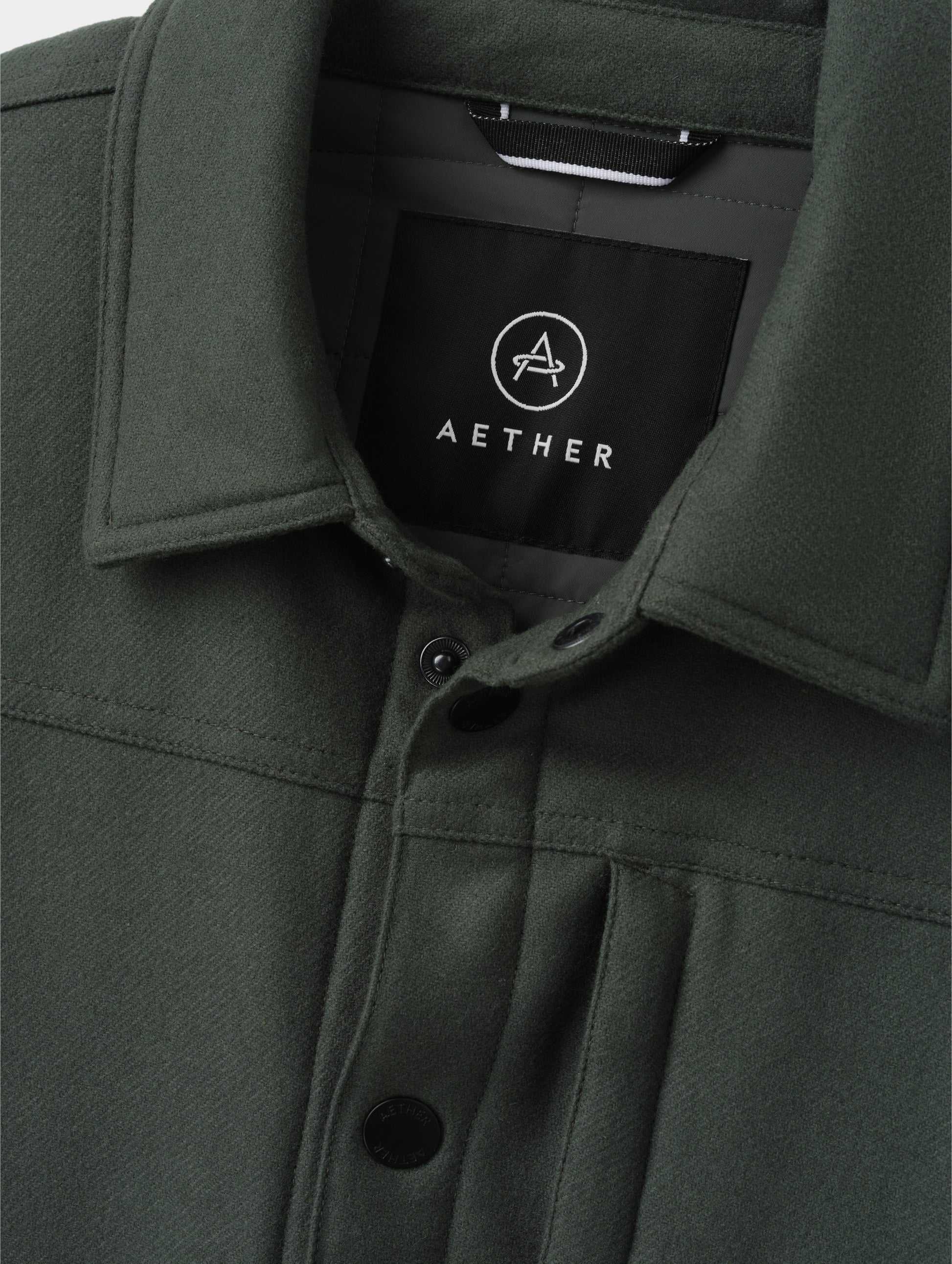 Closeup detailed view of the collar on the Nova Insulated Button-Down in Saville Green from AETHER Apparel.