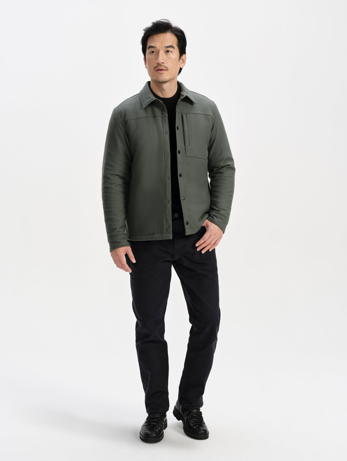 Front full-body view of man wearing the Nova Insulated Button-Down in Saville Green from AETHER Apparel.